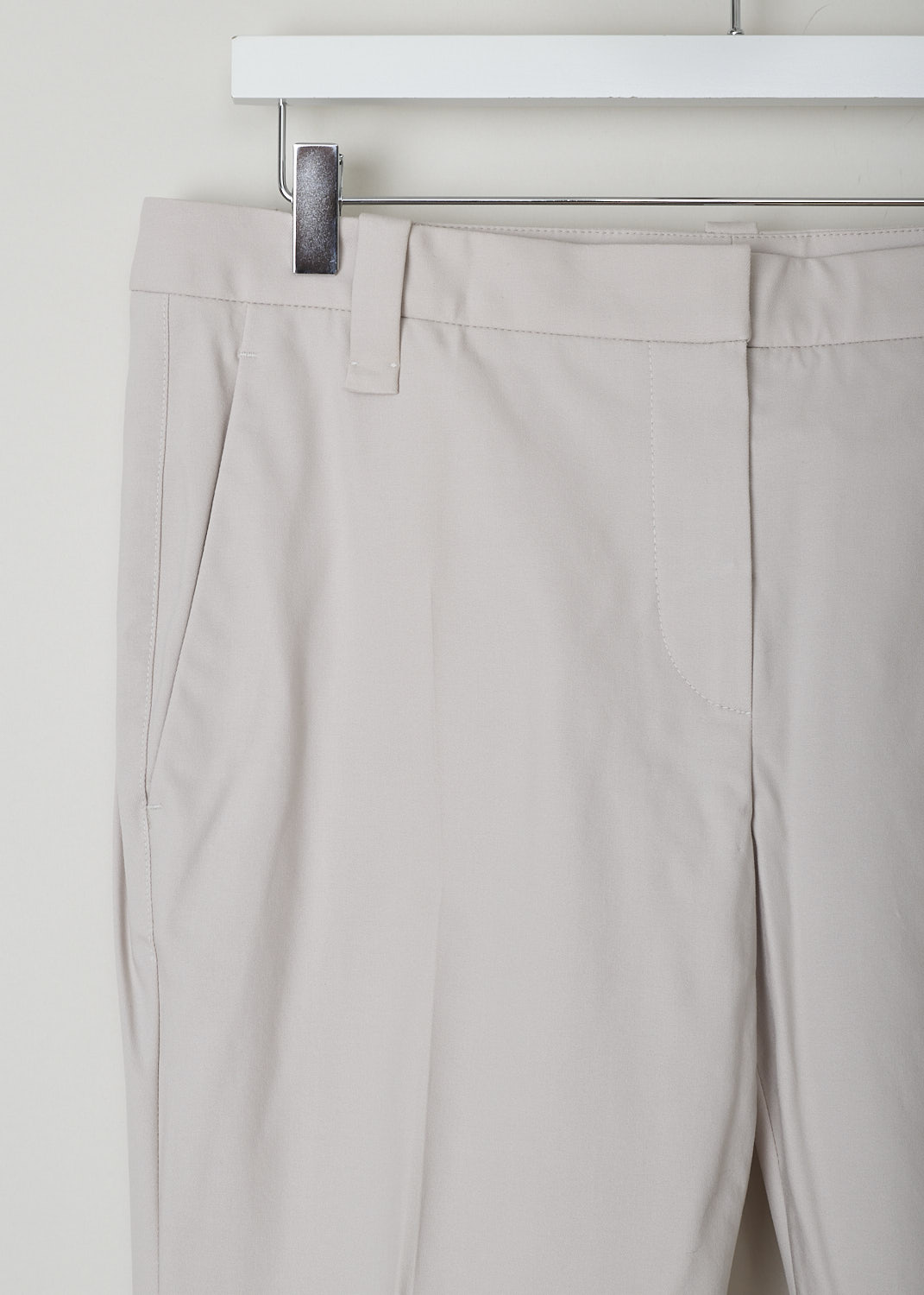 BRUNELLO CUCINELLI, BEIGE MID-RISE PANTS, M0F70P1995_C2837, Beige, Detail, These beige mid-rise pants have a waistband with belt loops and a concealed clasp and zip closure. In the front, these pants have slanted pockets. In the back, two welt pocket can be found. Centre creases run along the length of the tapered leg.
