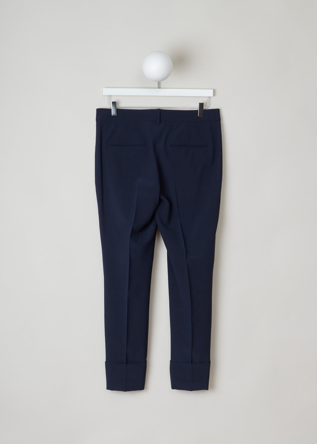 Brunello Cucinelli, midnight blue pants, MF533P6457_C2891, blue silver, back, Lovely wool navy pants. Featuring a cropped length with a wide turn up. The front has two slant pockets, the back has two welt pockets. The waistband has a metal detail for closure, with a push button and a French bearer button at the inside.