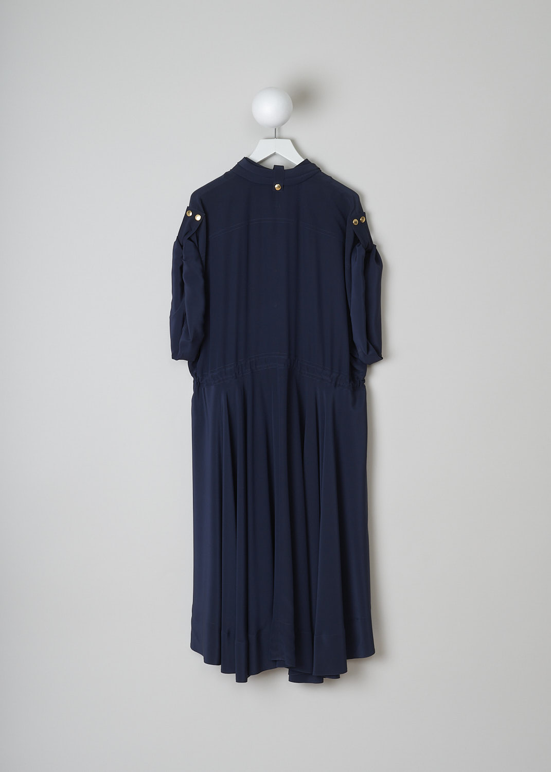 CHLOÃ‰, INK NAVY DRESS WITH GOLD-TONE BUTTONS, CHC19SRO510044C3_INK_NAVY, Blue, Back, This Ink navy silk maxi dress has gold-tone snap buttons throughout. The dress has a gathered collar with snap buttons and a front snap button closure. The wide long sleeves can be rolled up with snap buttons. On the front, the dress has two buttoned patch pockets and slanted pockets. A drawstring can be used to cinch in the waist. The dress has an asymmetric hemline.    
