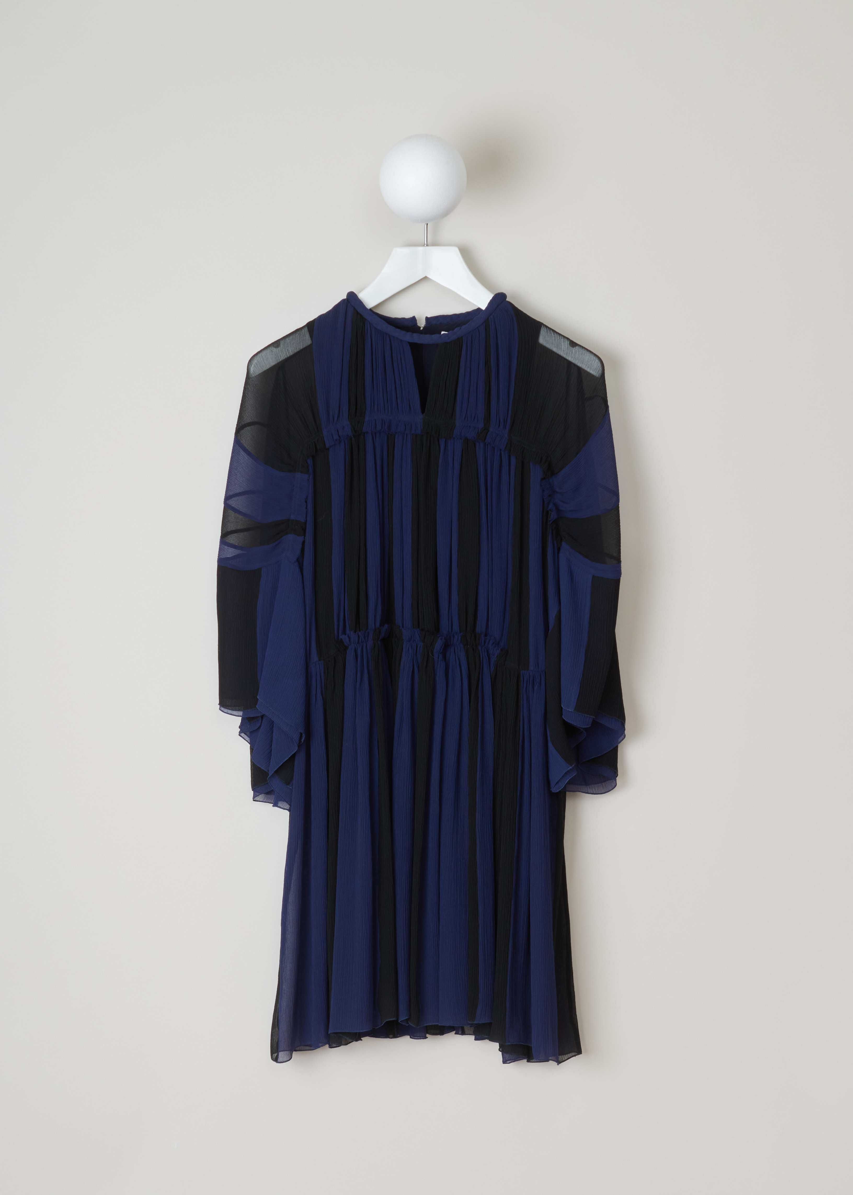 ChloÃ© Gathered slik crepe dress CHC19ARO37006925_925_Black_Blue front. This chic silk crepe dress has a blue and black vertically striped pattern. A gathered round neckline and ruffled sheer long sleeves. A ruffled waist and flared gathered midi skirt. 