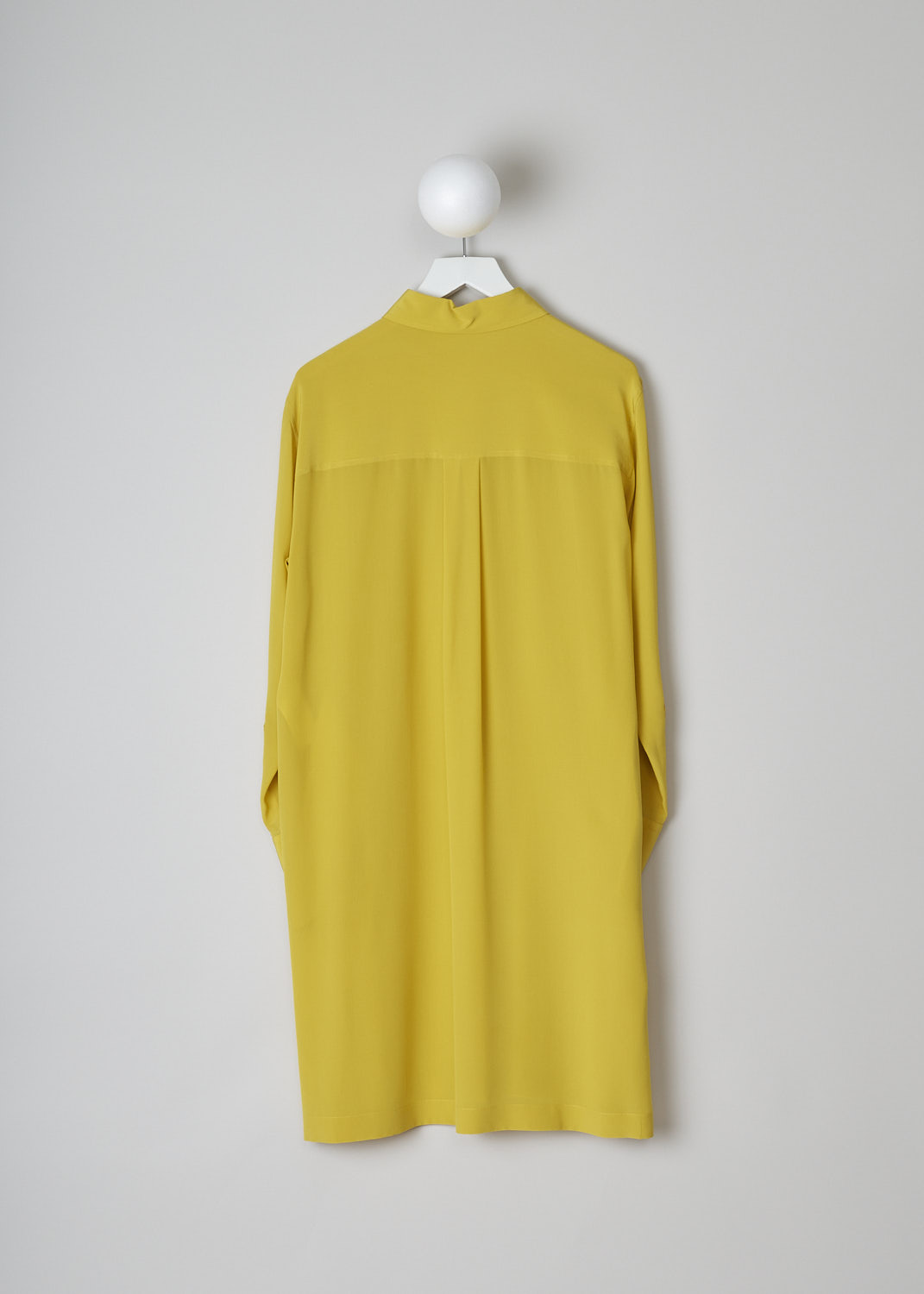 CHLOÃ‰, MUSTARD YELLOW DRESS, CHC22URO64004732_MUSTARD, Yellow, Back, This mustard yellow shirt dress has a spread collar and a front button placket with ceramic buttons that reaches about halfway down. The long sleeves have cuffs with those same ceramic buttons. Slanted pockets are concealed in the side seam. The dress has a straight hemline with side slits. In the back, the dress has a centre box pleat. 
 

