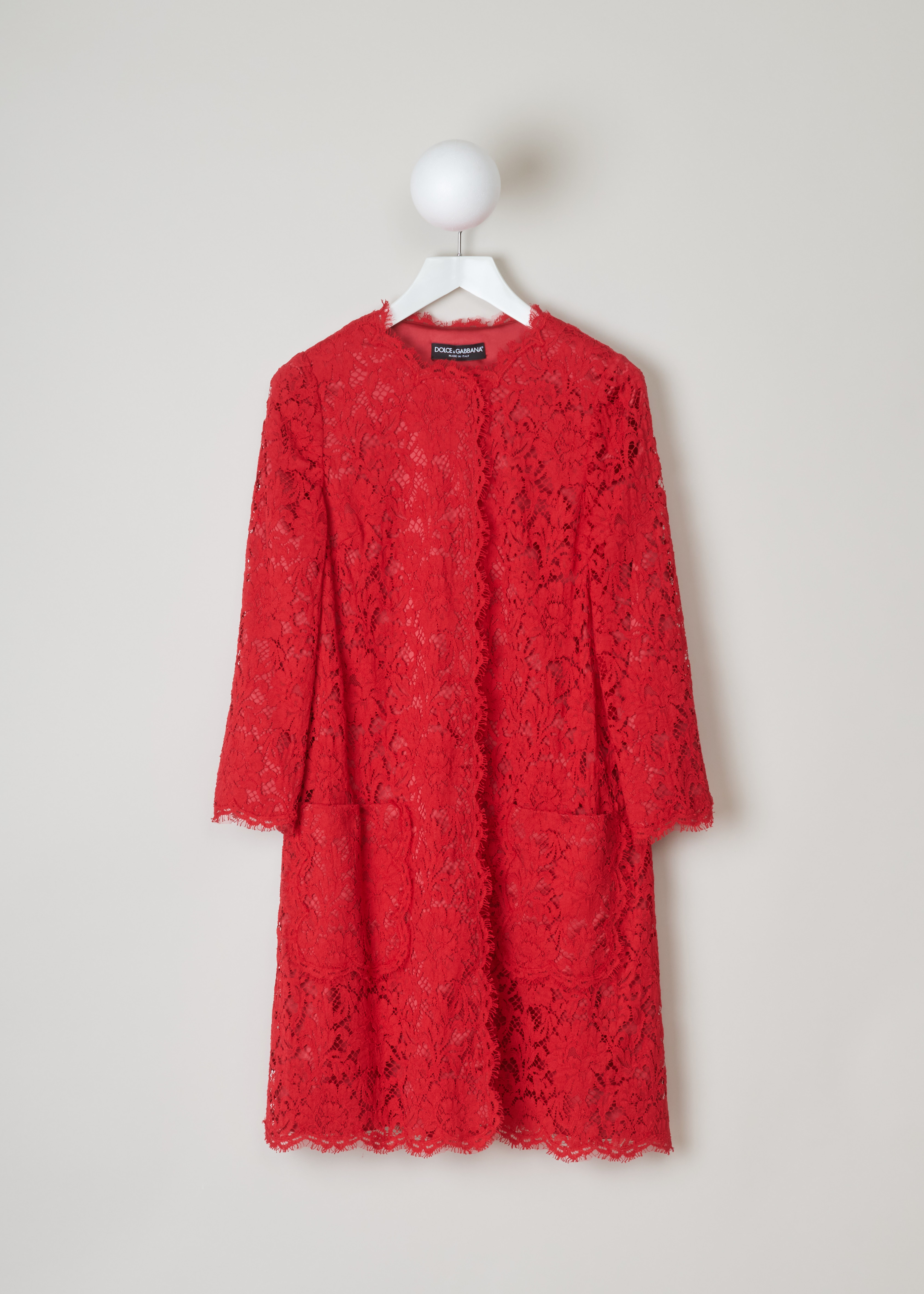 Dolce & Gabbana Red lace coat F0Q09T_HLMAK_R2254 rosso front. Red lace coat with long sleeves, a round neck, two patch pockets, scalloped hems and a snap button fastening.