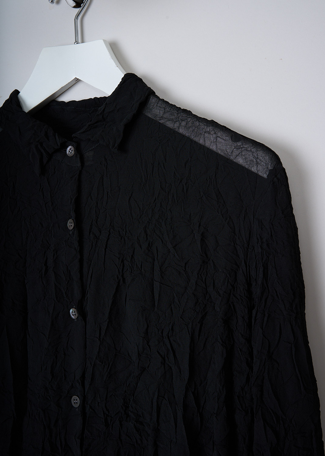 DRIES VAN NOTEN, BLACK CRUSHED BLOUSE, CRUSHED_6265_WW_SHIRT_BLACK, Black, Detail, This crushed black blouse has a spread collar and a front button closure. The blouse is slightly see-though. The long sleeves have buttoned cuffs. 
