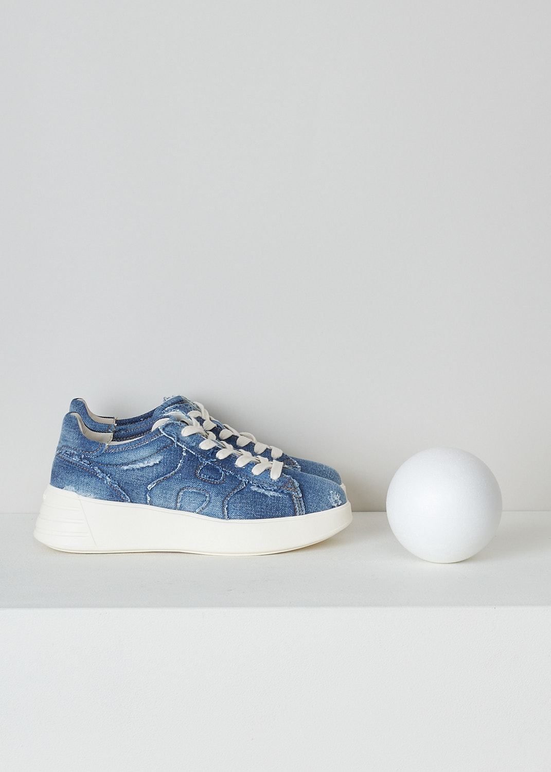 HOGAN, REBEL H562 ALL JEANS SNEAKER, GYW5620EY80JDLU803_H562, Blue, Side, These Rebel H562 All Jeans sneakers are made in a distressed denim fabric. These sneakers have a front lace-up fastening with white laces. These sneakers have a round nose and a broad white rubber sole. On the sides, the brand's H logo is incorporated in the design. The sneakers come with an additional pair of laces in blue. 
