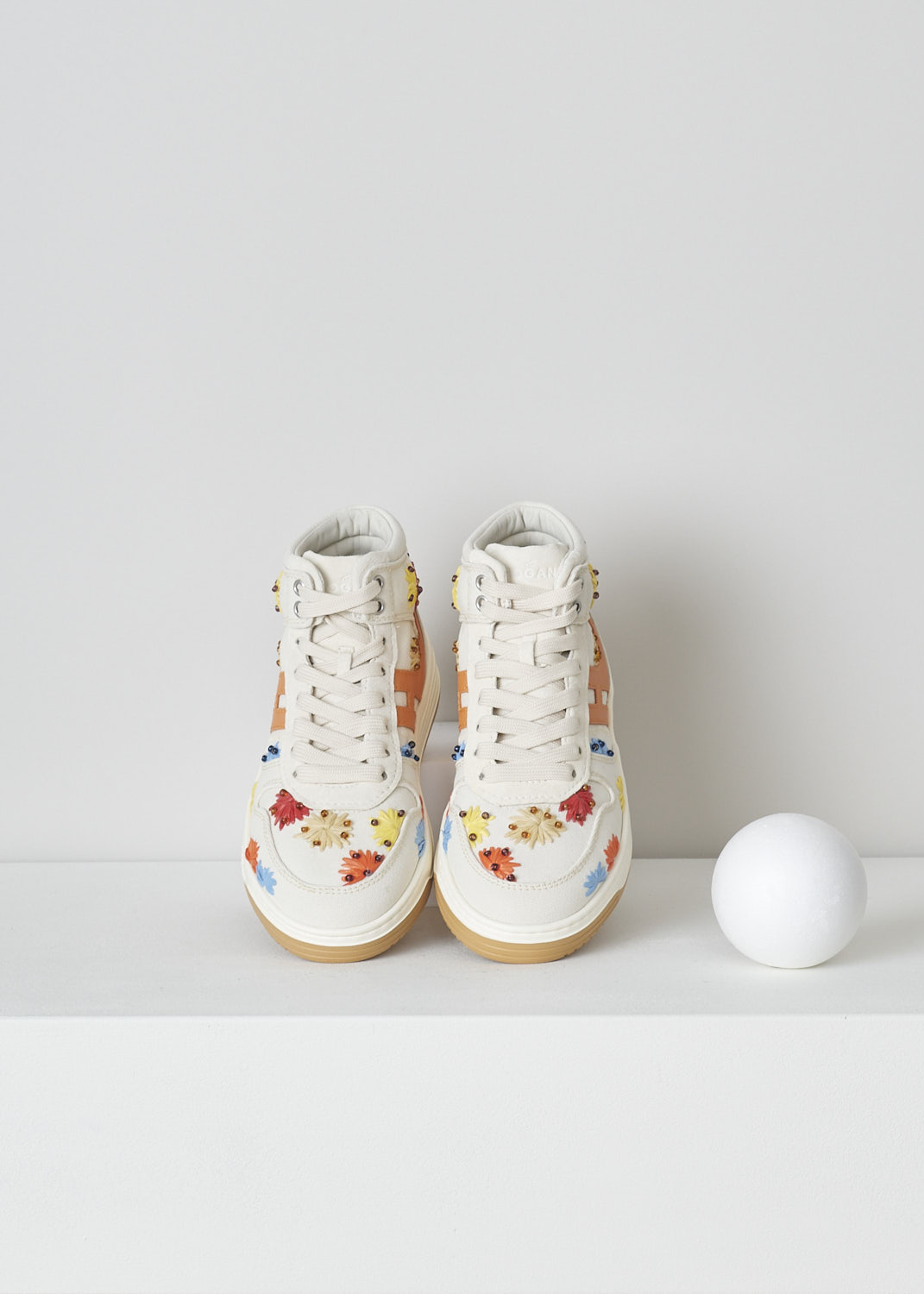 HOGAN, BEIGE HIGH TOP SNEAKERS WITH EMBROIDERY, GYW6300EZ10S530TA3_S53,  White, Orange, Red, Top, These high top sneakers have a front lace-up fastening. The sneakers have a beige canvas base with multicolored embroidered flowers. These flowers are further decorated with beads. On the sides, the brand's H-logo has been incorporated in the design in orange. These sneakers have  thick rubber soles. 


