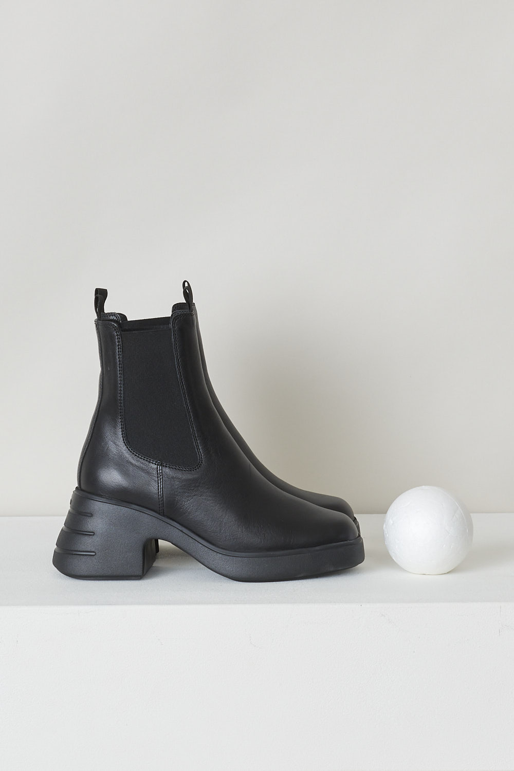 HOGAN, BLACK CHELSEA BOOTS, HXW6180EL20ZKAB999_H618_CHELSEA, Black, Side, These black Chelsea boots feature elasticated gusseted sides, a slightly squared toe and a chunky heel and sole. These boots have pull tabs on the front and back of the top edge. 


