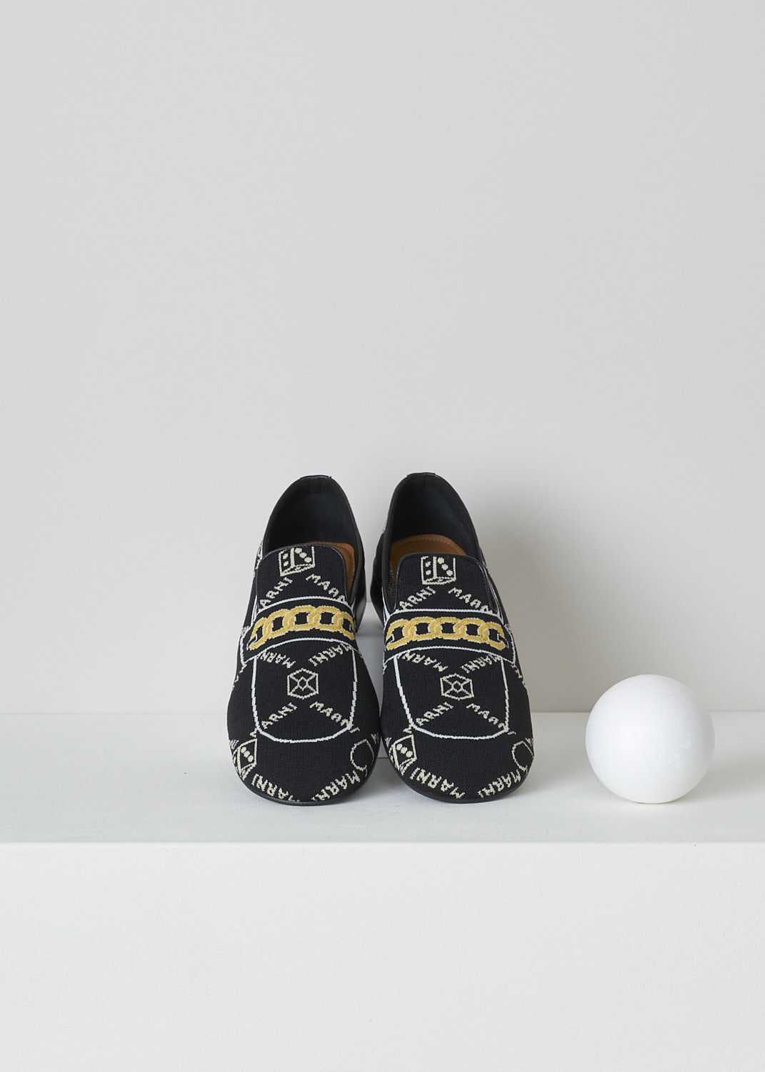 MARNI, BLACK TROMPE L'OEIL JACQUARD MOCCASINS, MOMS003601_P4601_Z2Q23, Black, Top, These black knitted moccasins have a trompe l'oeil image woven into them which depicts a gold chain across the vamp. The brand's logo is woven into them throughout the shoe in white. These moccasins have a round toe and flat rubber sole with a small heel. 
