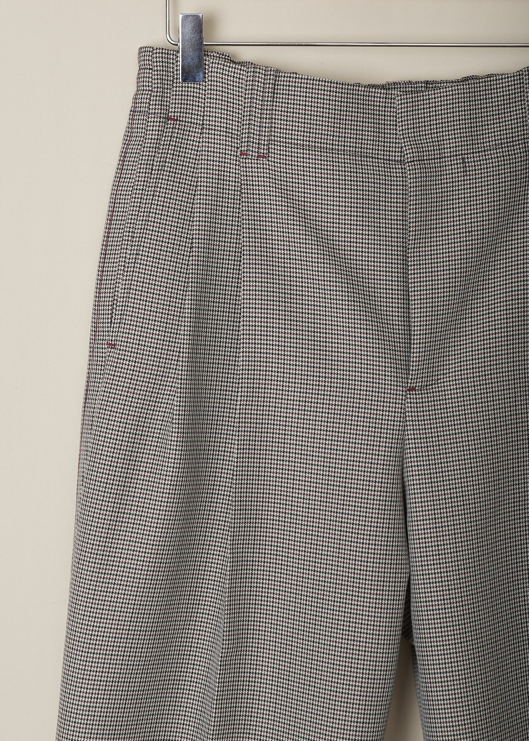 MARNI, RUBY HOUNDSTOOTH COMPACT WOOL PANTS, PAMA0440U0_UTWA03_PDR82, Brown, Red, Print, Detail, These high-waisted ruby Houndstooth pants have a slightly elasticated waistline with belt loops and a concealed button and zip closure. In the front, these pants have slanted pockets, pleats and centre creases that run along the length of the straight pant legs. In the back, these pants have two buttoned welt pockets; one with flap and one without. 
