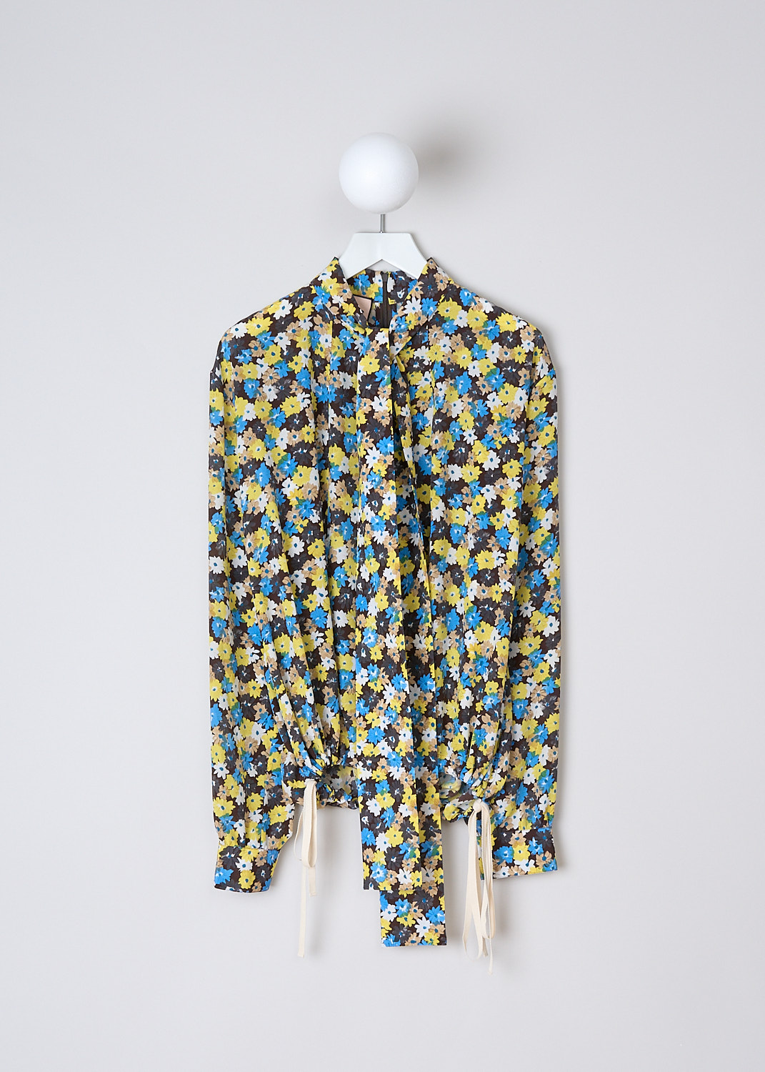 PLAN C, DAISY BOUQUET CRÊPE DE CHINE BLOUSE, CMCAD55K00_TS011_FIY04, Yellow, Print, Blue, Front, This long sleeve Crêpe de Chine blouse has an all-over Daisy Bouquet print. The blouse has a bow-tie neckline. An inverted pleats runs vertically down the front. The long sleeves have buttoned cuffs. The blouse has a hemline with drawstrings on either side. In the back of the neck, the blouse has a concealed centre zip.



