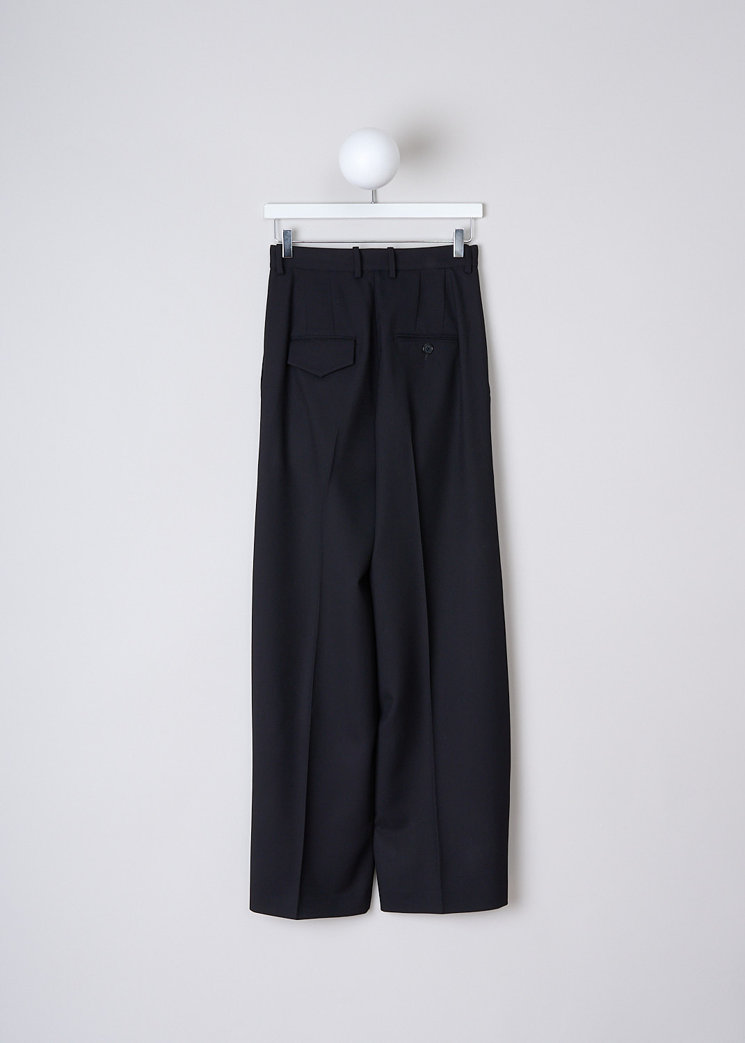 PLAN C, NAVY BLACK WOOL DRILL PANTS, PNCAA55L08_TW039_00B98, Black, Blue, Back, These navy black drill wool pants  have a waistband with belt loops and a button and zip closure. The pants are high-waisted with wide pant legs. Pressed centre creases run along the length of the pant legs. These pants have slanted pockets in the front. In the back, the pants have one flap welt pocket and one buttoned welt pocket. 
