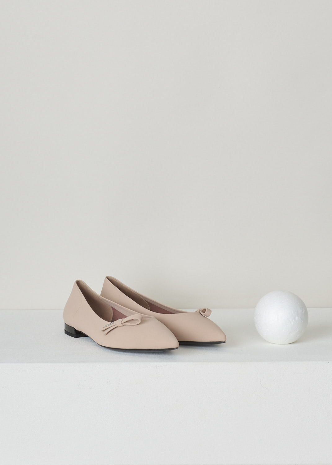PRADA, NUDE BALLET FLATS WITH POINTED TOE, TESSUTO_TECH_1F273L_3KQ6_F0A48_NUDO, Pink, Front, Side, These nude colored ballet flats have a pointed toe with, along the topline, a bow with the brand's name in silver-toned letters. These slip-in flats have a small heel. 
