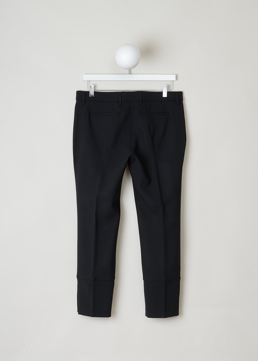 Prada, Black wool pants, Tela_Natte_STR_P2291_F0002_Nero, black, back, Made in the classic pants model. What sets this model apart is the hem, which comes adorned with a buttoned split. 