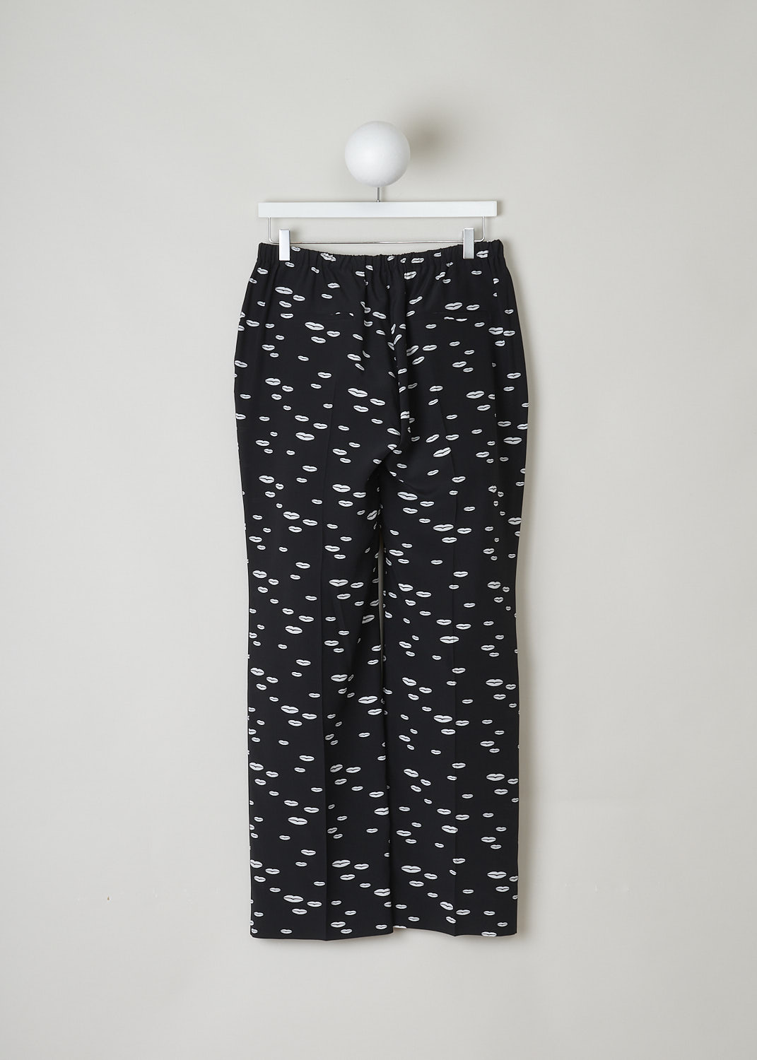 PRADA, BLACK PANTS WITH WHITE LIP PRINT, CDC_BOCCA_P235E_F057Z_NERO_AVORIO, Black, White, Print, Back, These black silk pants have an all-over lip print in white. This slip-on model has an elasticated waistline. These pants have slanted pockets in the front and welt pockets in the back. The straight pant legs have centre creases. 
