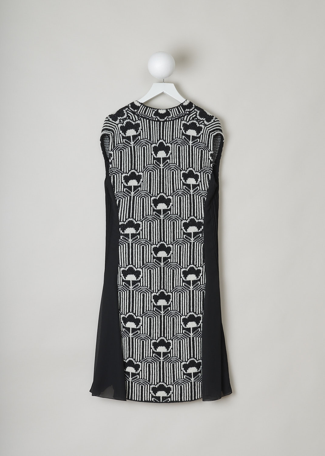 PRADA, BLACK AND WHITE JACQUARD DRESS, P3F95_F0967_JACQUARD_GEORGE_NERO_BLANC, Front, Back, White, Print, This sleeveless slip-on dress is made in a black and white knitted floral-jacquard print. The dress has black pleated inserts on either side. The V-neckline has a ribbed finish. The dress has a below-the-knee length. 
