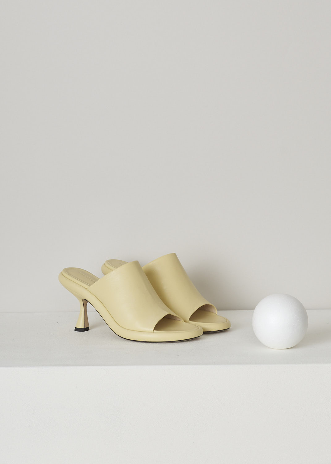 WANDLER, JUNE PLATFORM PUMP IN CANDLE, 22208_871201_1435, Yellow, Front, These pale yellow heeled slip-on mules have a broad strap across the vamp, a rounded open-toe and a platform sole. The slip-on mules have a mid-height spool heel.
