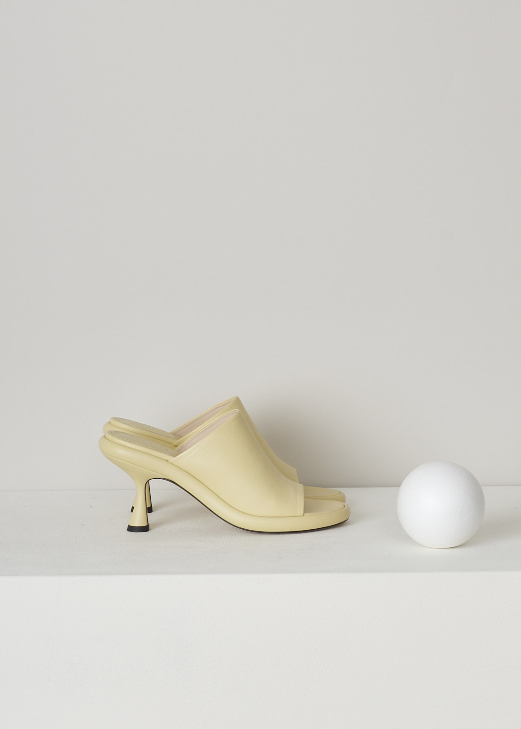 WANDLER, JUNE PLATFORM PUMP IN CANDLE, 22208_871201_1435, Yellow, Side, These pale yellow heeled slip-on mules have a broad strap across the vamp, a rounded open-toe and a platform sole. The slip-on mules have a mid-height spool heel.
