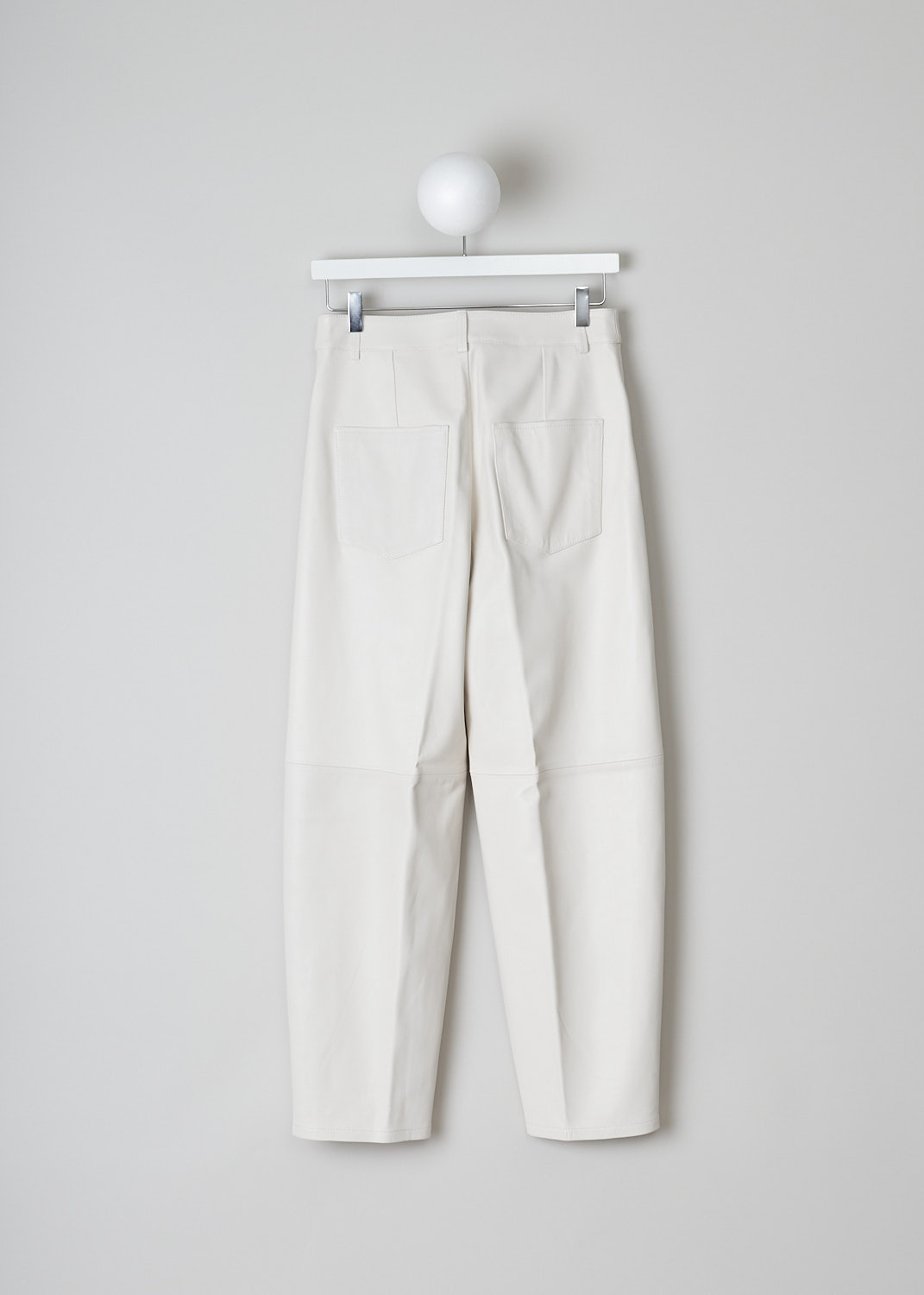 WANDLER, CHAMOMILE LILY PANTS, 22306_060301_1064_CHAMOMILE_LILY, White, Back, These white leather Chamomile Lily pants have a waistband with belt loops and a button and zip closure. The pants have a high-waisted fit. The balloon legs are cropped at the ankle. These pants have slanted pockets in the front and patch pockets in the back. 

