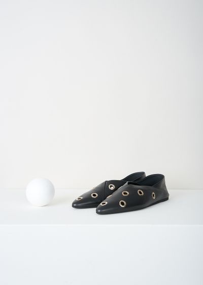 Closed Black ballet flats with eyelet studs