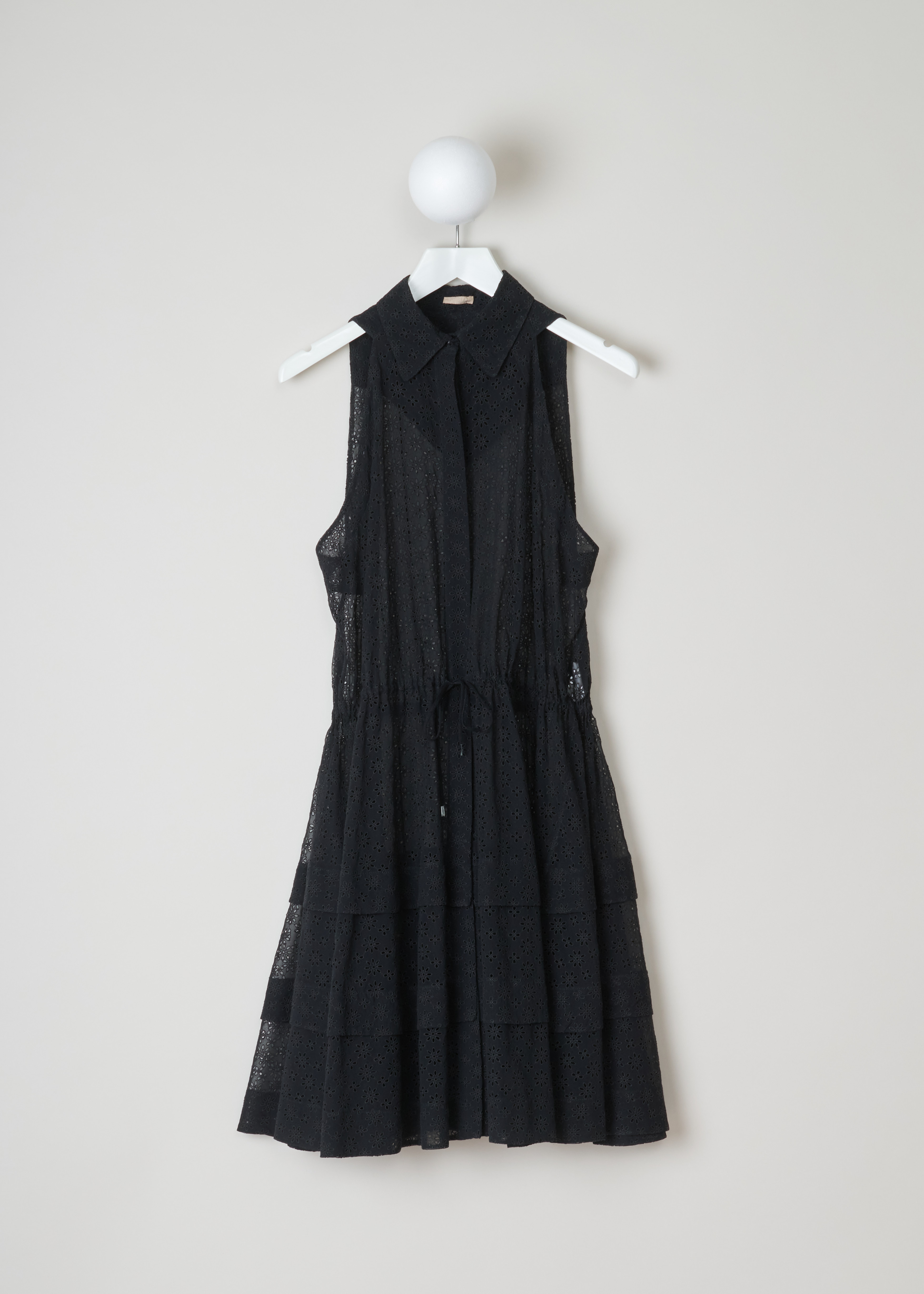 AlaÃ¯a, embroidered blouse dress, 10HPTBD4R296_robe_3_volants_099_noir, black, front. Slightly see-through dress, with embroidered floral motive, comes in a blouse dress model. Starting from the top this dress features a pointed collar and a small capelet feature on the back. A cord tunnel on waist height to adjust the waist width and below that the skirt of this dress comes in a layered from. 