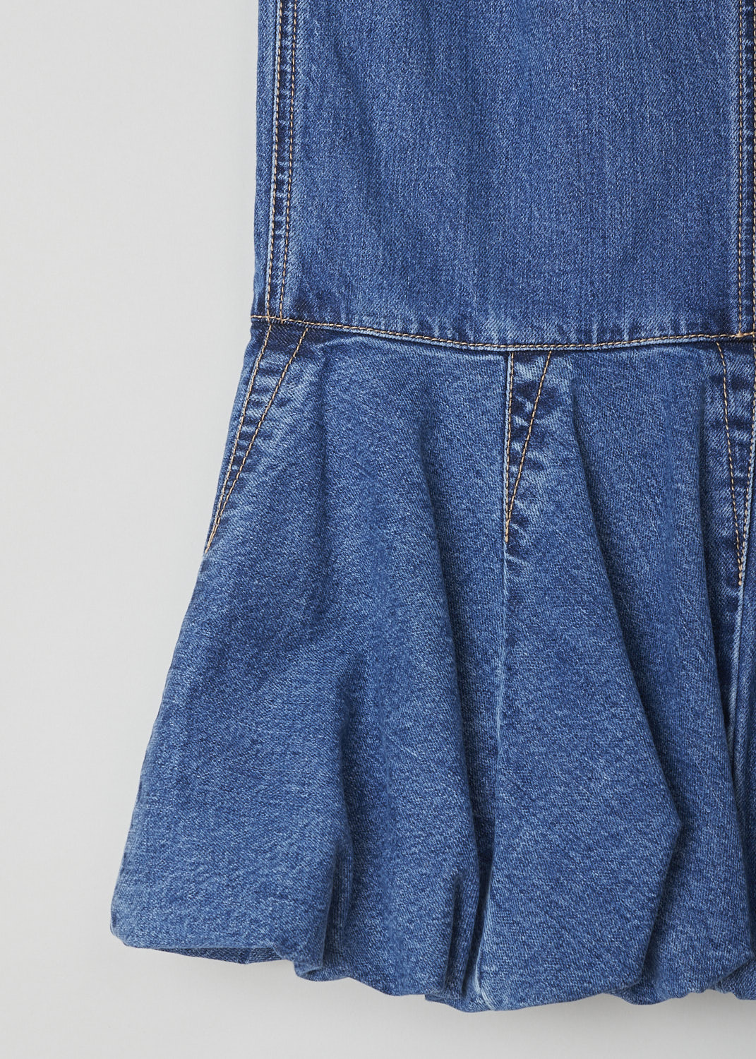 ALAÏA, BLUE DENIM FIT-AND-FLARE SKIRT, AA9J03922T441_BLEU_JEANS, Blue, Detail, This blue denim midi skirt has a fit-and-flare silhouette with a broad voluminous trim. A concealed side zip functions as the closure option. In the back, decorative seams can be found. 
