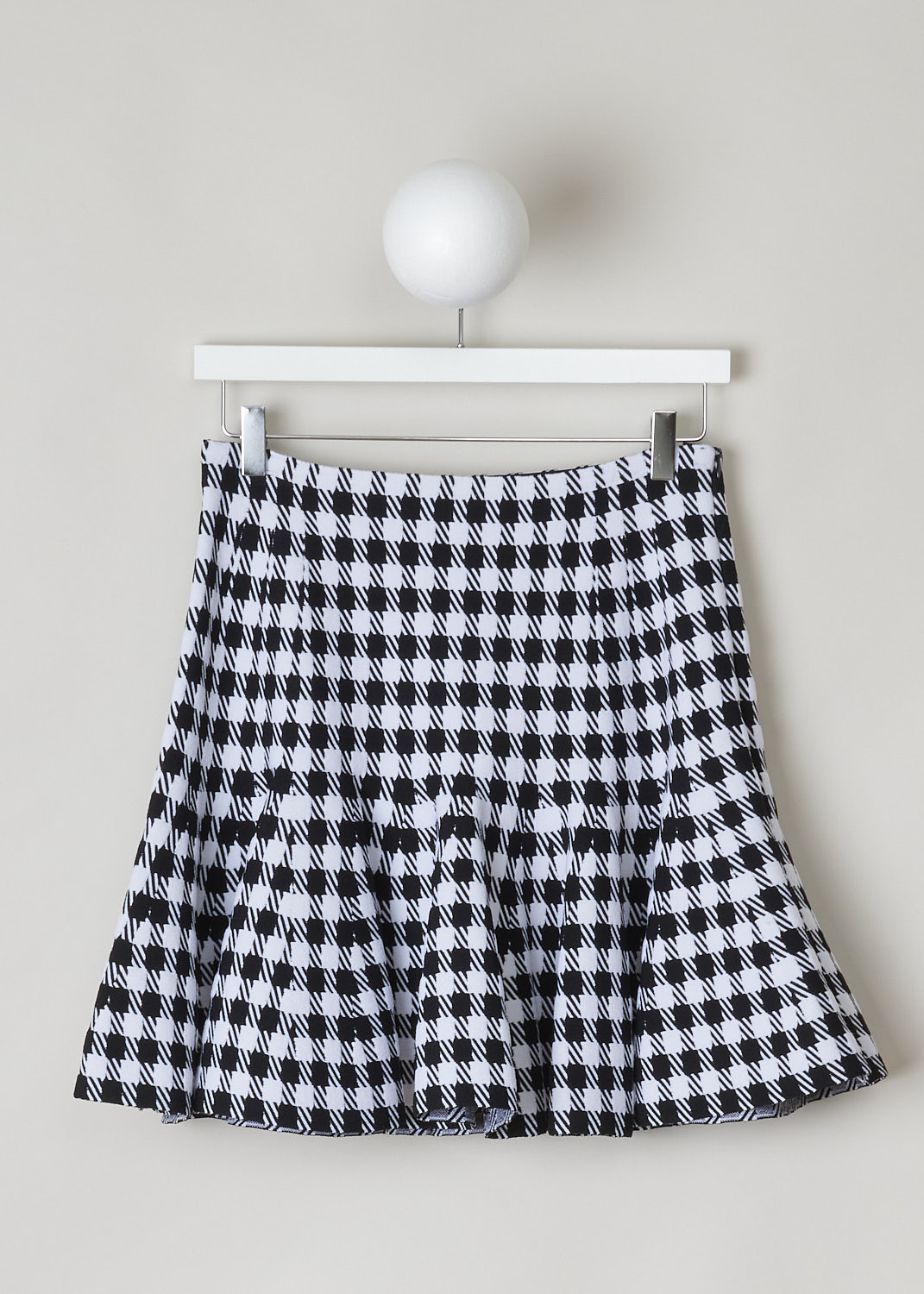 ALAÏA, FIT-AND-FLARE HOUNDSTOOTH MINI SKIRT, Black, White, Print, Front, This fit-and-flare mini skirt has a magnified black and white Houndstooth print throughout. The skirt sits high on the waist and flares out. A concealed side zip functions as the closure function. The skirt is fully elasticated.

