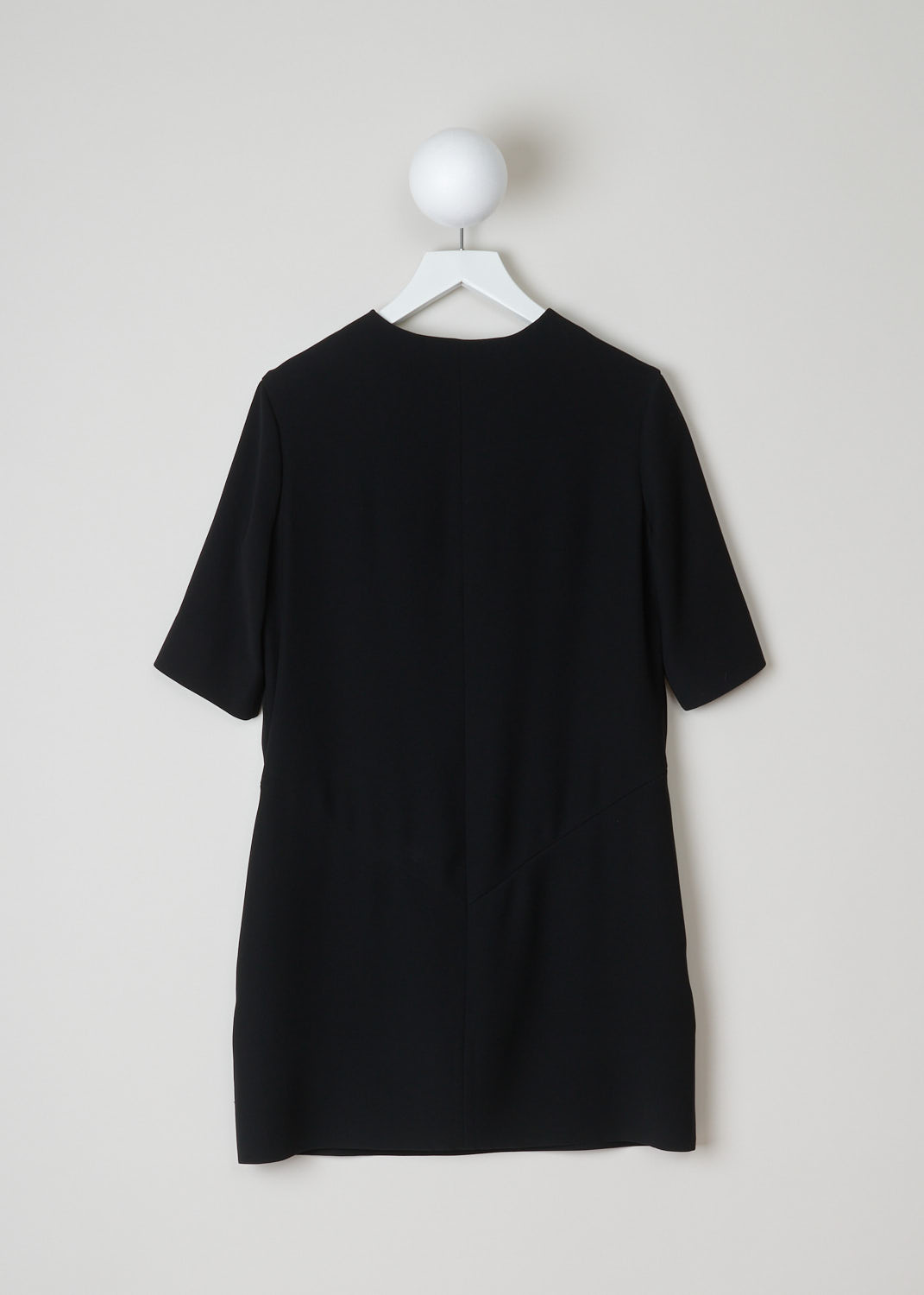 Balenciaga, Midi black shift dress, 384112_TFDD7_1000, black, back. Featuring a decollete with split at the front. Combined with a round neckline and short sleeves. The length of this model sits just above the knees and as your fastening option this model has a metal clip on the front which allows for a easy entry of exit. 