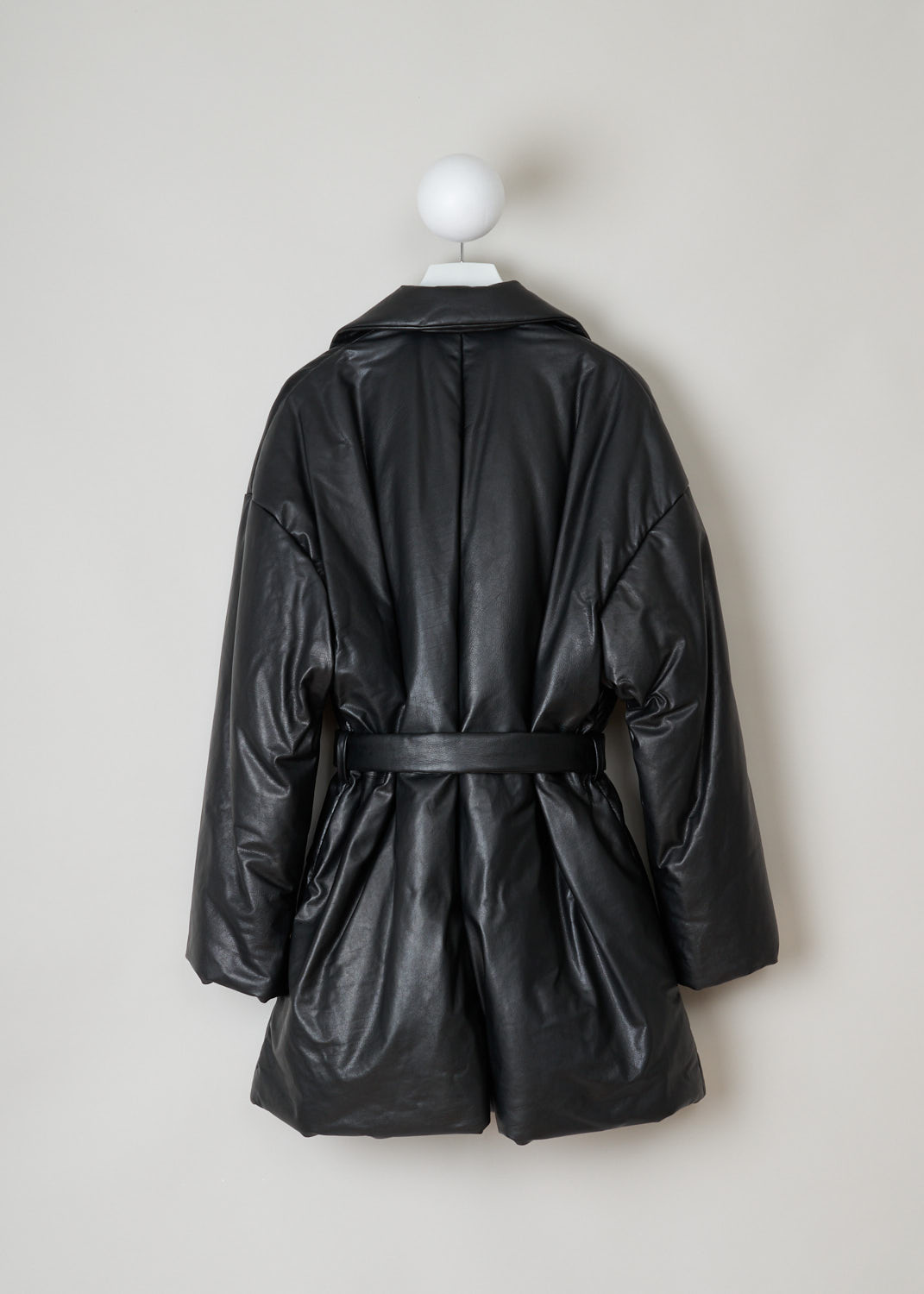 Balenciaga, Black lined leather coat, 583549_TFS06_1000, black, back. Lovely black quilted, calfskin coat made by true craftsmen. Featuring a collar that leads into the notched lapel, which leads into the fastening option being, waist-tie ribbon made from the same fabric. Comes with dropped shoulders and long sleeves. Furthermore two welt pocket can be found on the front and two more slip-in pockets on the inside.  