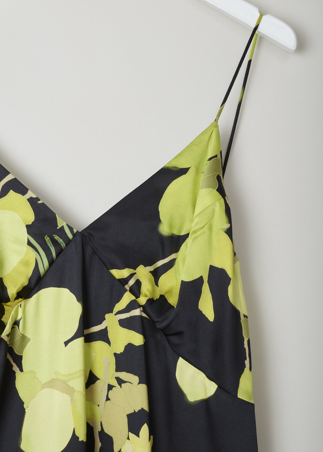 BERNADETTE, BLACK SILK SLIP DRESS WITH VIBRANT PRINT, HS22_RTW_SLDRESS_JEA_SSS_2, Black, Print, Detail, Silky smooth black satin midi dress with lime green print. The dress has a V-shaped neckline with barely-there straps. It's decorated with vibrant lemons and daffodils. 