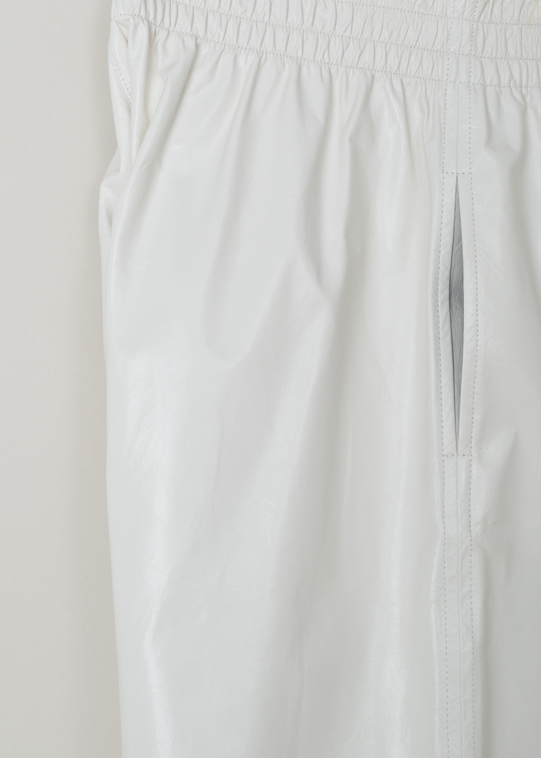 Bottega Veneta, White patent leather shorts, 633445_VKLC0_9068, white, detail, these shorts made from white shiny leather. Featuring an oversized fit with the slip-in pockets being on the side seam, the elastic waistband acts as you fastening method on this model. 