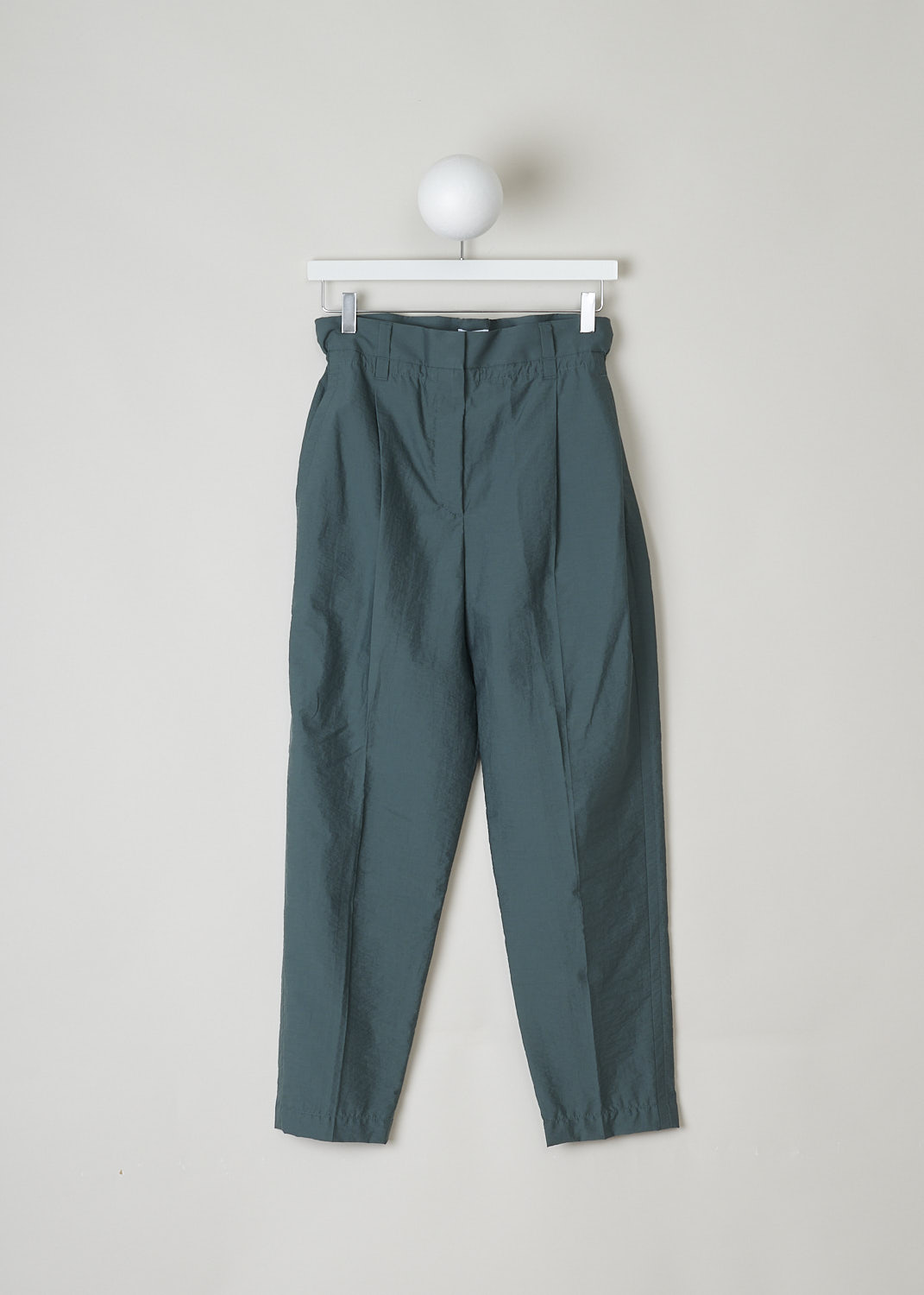 BRUNELLO CUCINELLI, TEAL GREEN PAPER BAG PANTS, M0F79P7102_C7287, Green, Blue, Front, These teal green pants have a paper bag waist with belt loops.  The waistline is partly elasticated. The concealed press studs and zip function as the closure option. These pants have slanted pockets in the front and welt pockets in the back. The tapered pant legs have a centre crease. 
