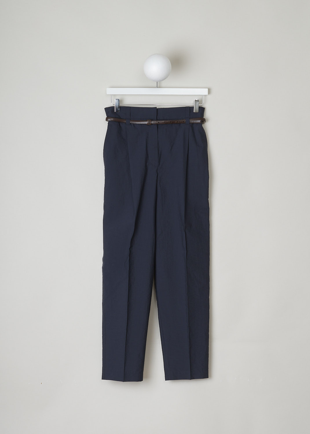 BRUNELLO CUCINELLI, NAVY BLUE PANTS WITH A BROWN LEATHER BELT, M0F79P7216_C7186, Blue, Front, These navy blue pants are made of a breathable cotton and feature a concealed snap and zip closure. These pants come with a brown leather belt with a subtle Monilli beaded detail. The tapered pant legs a centre creases. In the front, slant pockets can be found. In the back, these pants have welt pockets.
