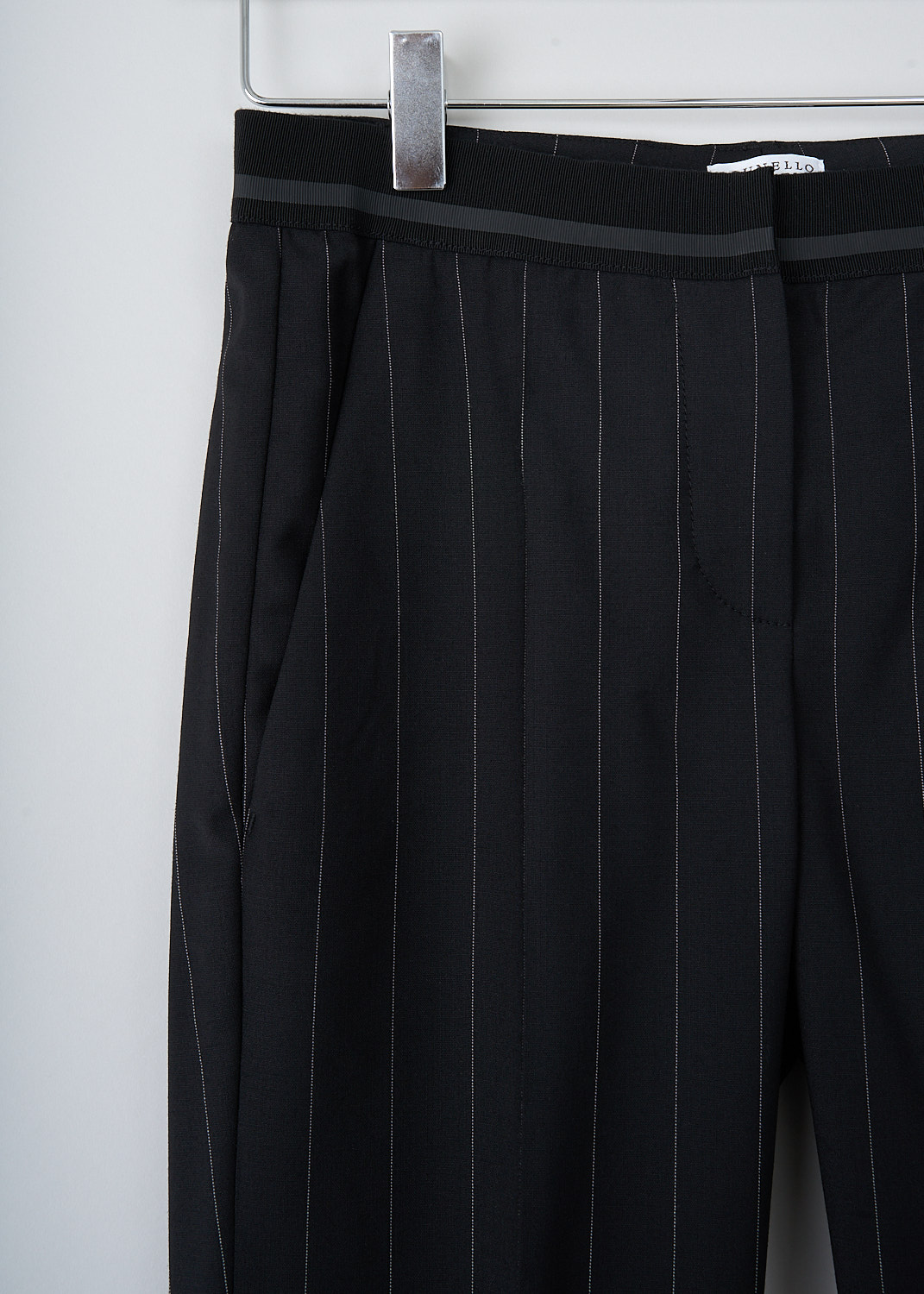 BRUNELLO CUCINELLI, BLACK TROUSERS WITH PINSTRIPE, M0H35P1500_C180, Black, Detail, These black pinstripe pants are made of a wool blend. Featuring a partly elasticated waistline, forward slanted pockets in the front, and two buttoned welt pockets in the back. Along the length of the pant leg, centre creases can be found. These pants have a folded hem.