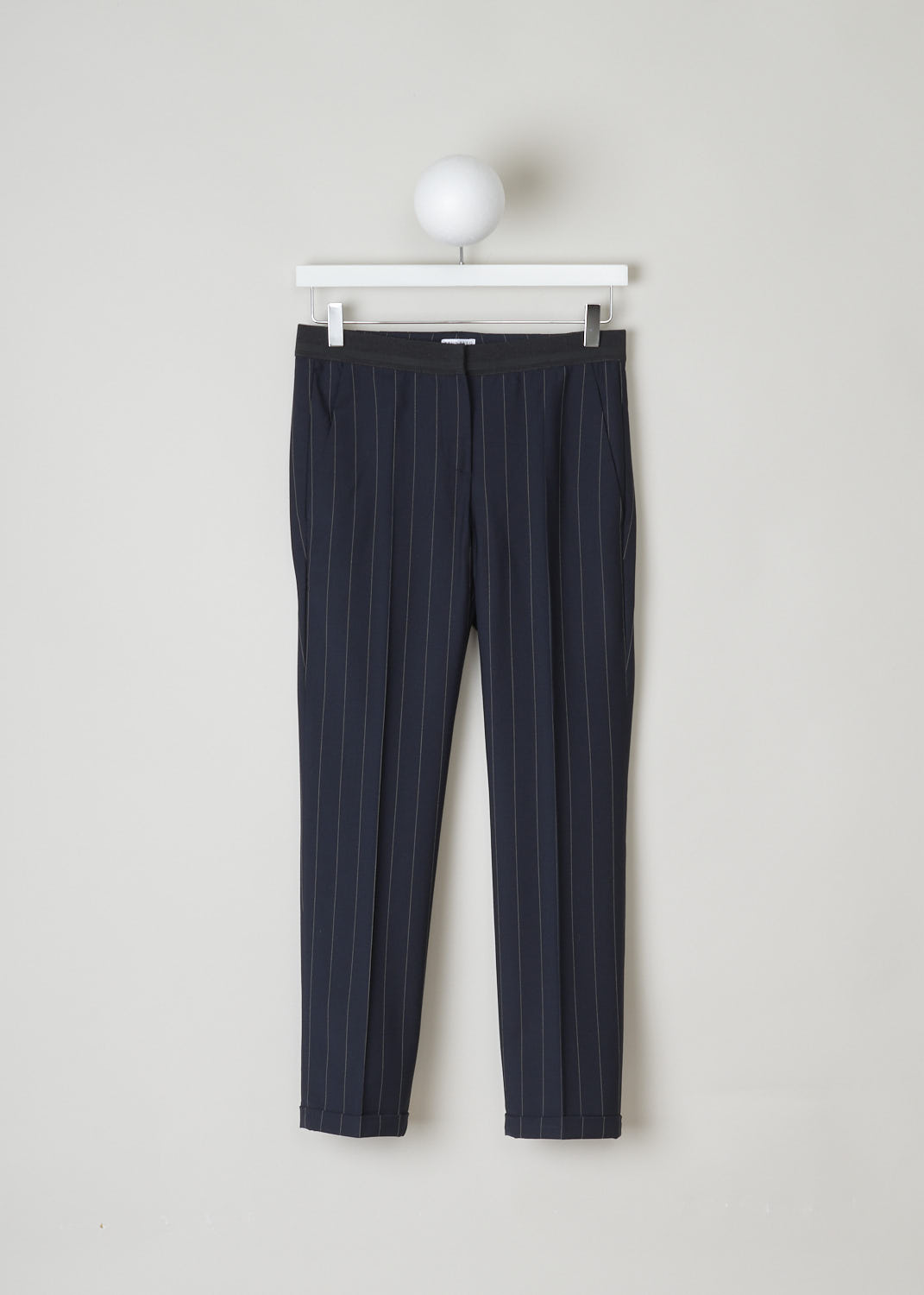 BRUNELLO CUCINELLI, NAVY BLUE TROUSERS WITH PINSTRIPE, M0H35P1500_C6009, Blue, Front, These navy blue pinstripe trousers are made of a wool blend. Featuring a partly elasticated waistline, forward slanted pockets in the front, and two buttoned welt pockets in the back. Along the length of the pant leg, centre creases can be found. These trousers have a folded hem.
