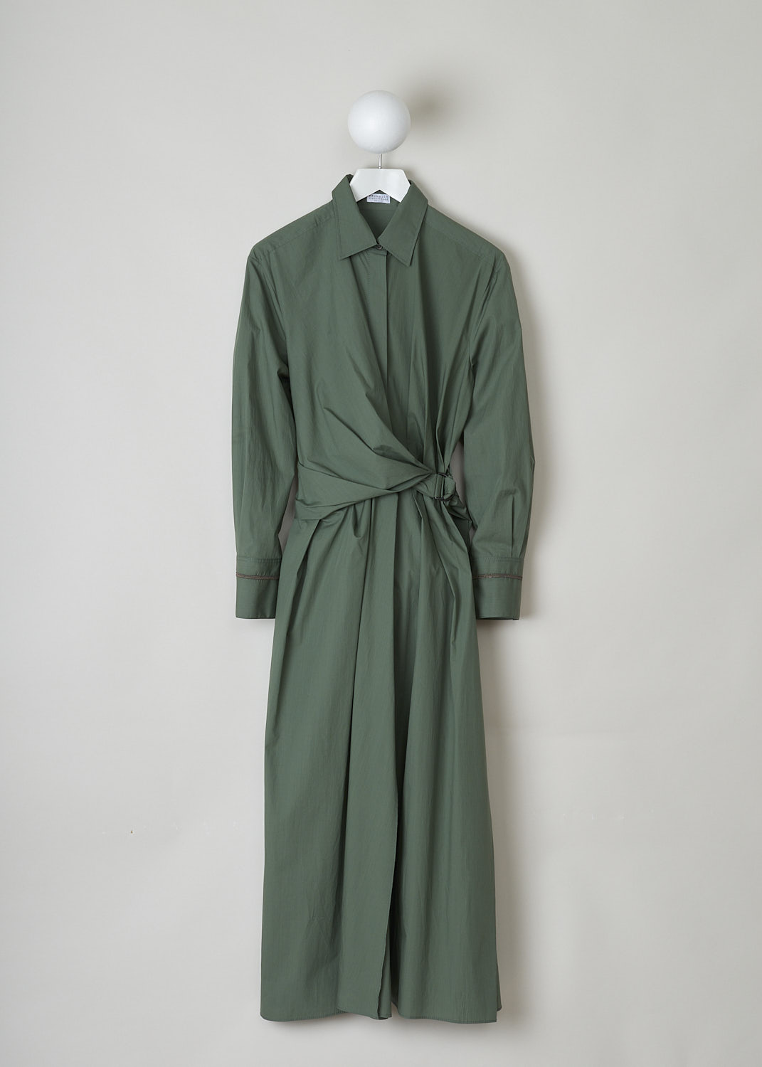 BRUNELLO CUCINELLI, GREEN SHIRT DRESS WITH WRAP DETAIL, M0H93A4873_C8625, Green, Front, This green midi shirt dress has a classic collar and concealed front button closure that goes down to the waistband. The waistband is elasticated at the back. The waist is accentuated by the wrap detail, that goes around like a belt and is fastened to one side with the metal buckle. The long sleeves have buttoned cuffs and are decorated with a monili beaded trim.
