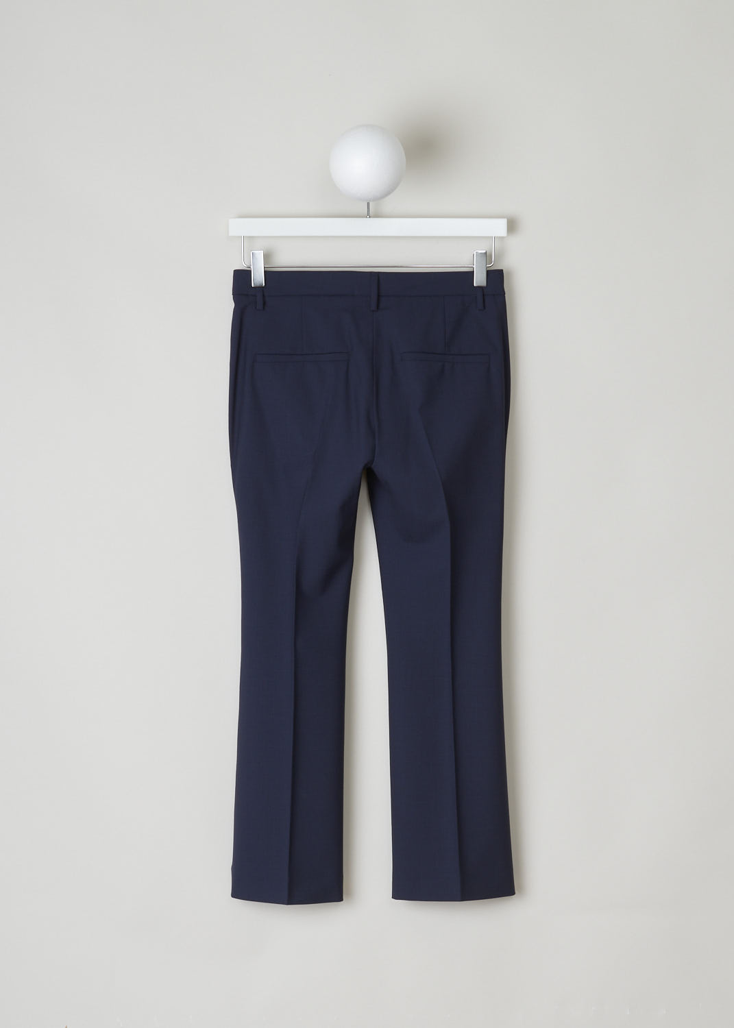 BRUNELLO CUCINELLI, NAVY BLUE STRAIGHT LEG TROUSERS, M0W07P1951_C2831, Blue, Back, Navy blue pants, featuring a flat front model. This low-cut model has a cropped length, slanted pockets in the front and two welt pockets in the back. Fastening option on this model is a zipper, a metal clip and a backing button. 
