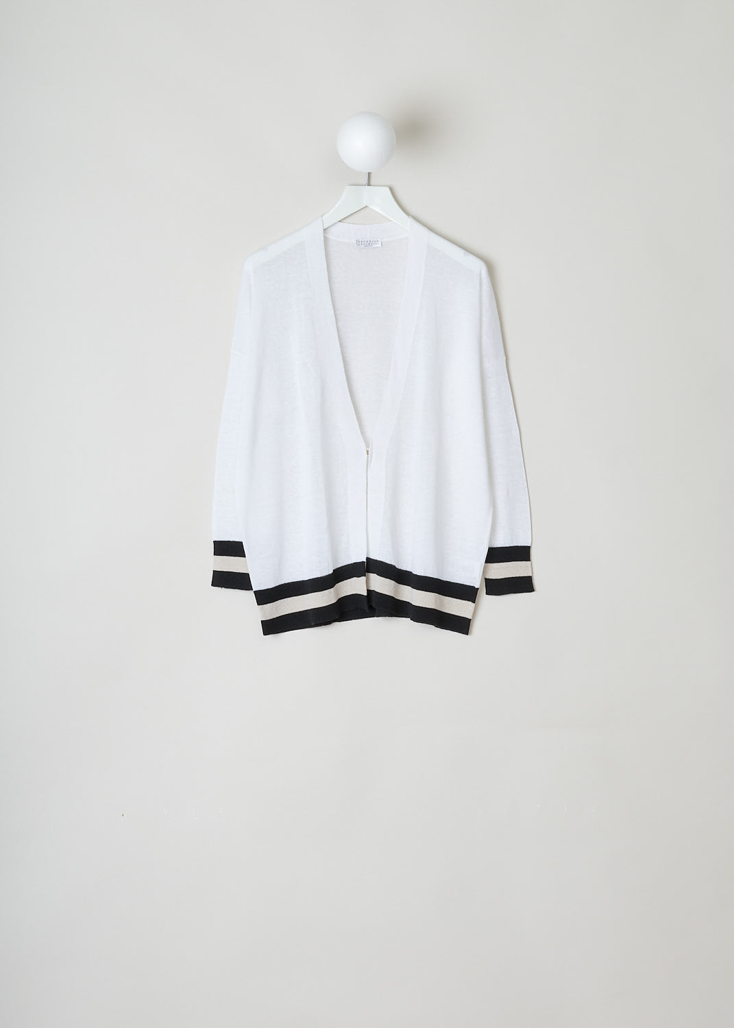 Brunello Cucinelli, Oversized white cardigan, M1T132426_C159, white, front, A white cardigan with an oversized fit, dropped shoulders and long sleeves. The cuffs and hem are striped black and beige. The fastening option here comes in the form of a single button on the front. 