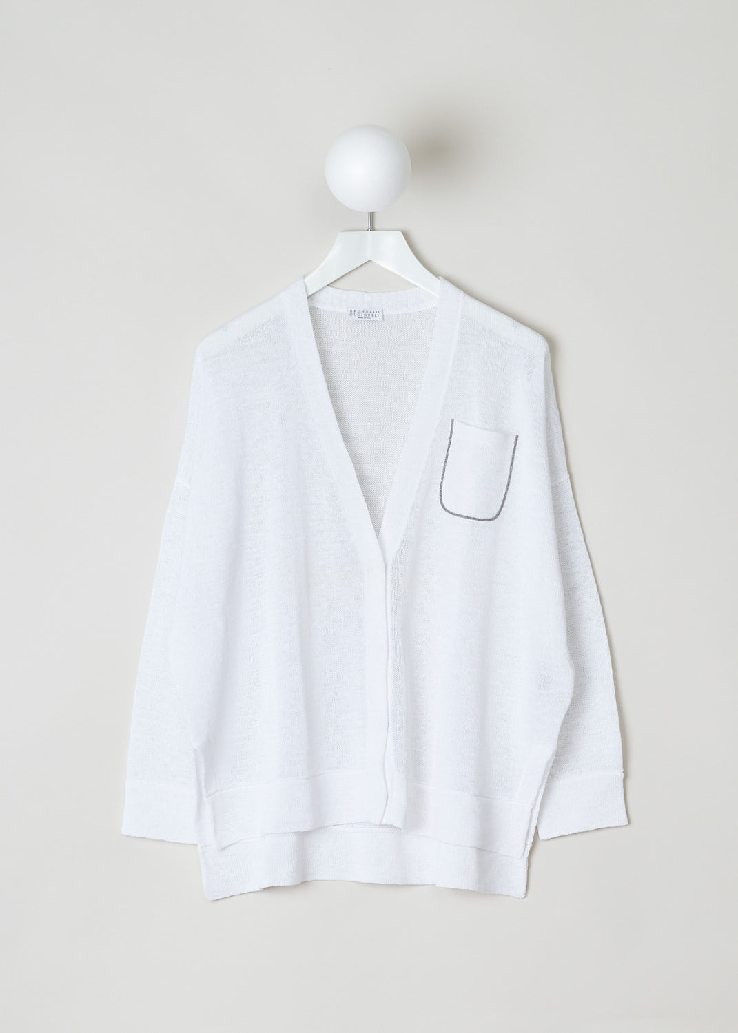 Brunello Cucinelli, Oversized white cardigan, M78733606_C159, white, front, White oversized model featuring dropped shoulders and 3/4 sleeve length. Below the v-shaped neckline sits the fastening option in the form of concealed press studs. The overall fit is asymmetric, meaning the back is left longer than front. Further decorating the front are two slip-in pockets and a patch pocket on chest-height. 
