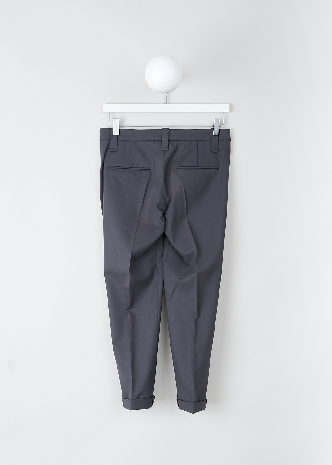 Brunello Cucinelli, Anthracite pants with monili detailing, MA030P1837_C2355, Grey, Back, These anthracite pants have a waistband with belt loops and a concealed clasp and zip closure. These pants have slanted pockets in the front and welt pockets in the back. The tapered pant legs have pressed creased and a folded hem with subtle monini detailing on the seam. 
