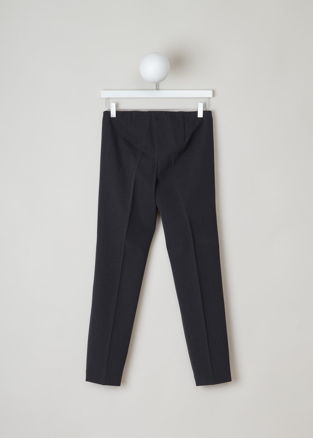 Brunello Cucinelli, straight charcoal pants, MA051P1794_C004, grey, back, Empower your outfit with these minimalistic designed pants. Comes in a lightweight wool in charcoal grey and midnight blue. These low-cut pants have a slim fit and slightly tapered legs.
A concealed elasticated waistband and closes with an invisible zip on the side.