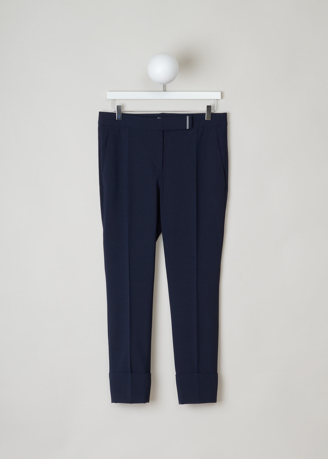 Brunello Cucinelli, midnight blue pants, MF533P6457_C2891, blue silver, front, Lovely wool navy pants. Featuring a cropped length with a wide turn up. The front has two slant pockets, the back has two welt pockets. The waistband has a metal detail for closure, with a push button and a French bearer button at the inside. 