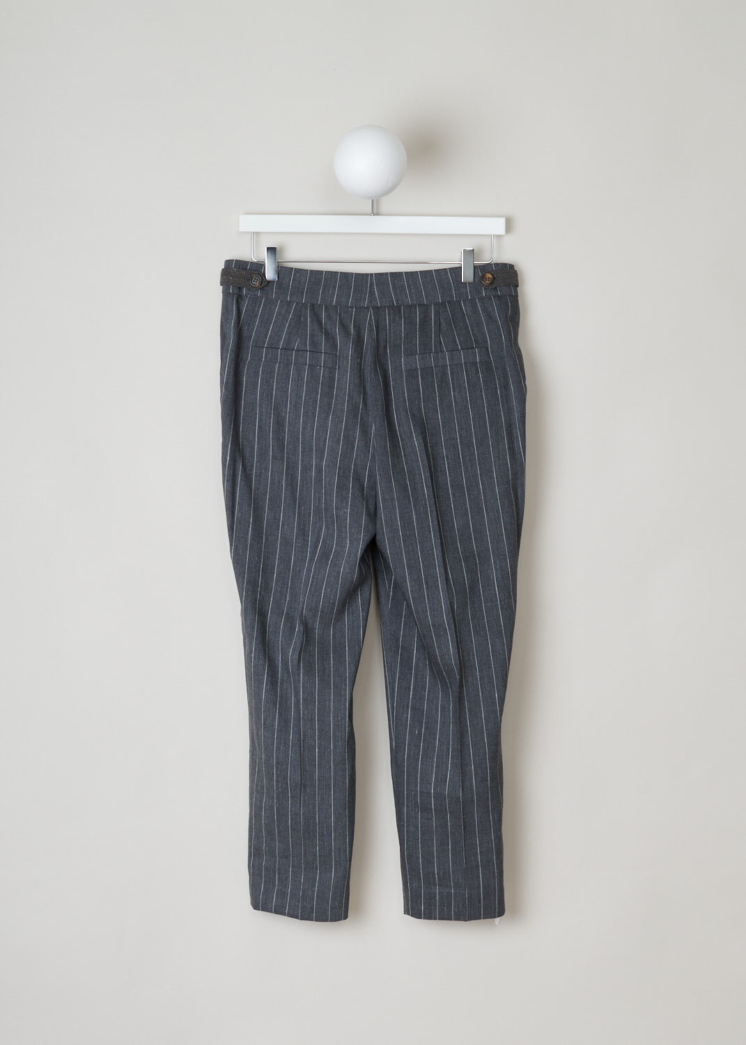 Brunello Cucinelli, mid grey pinstripe pants, MF554P6492_C002, grey white, back, Mid grey pants, made of a pinstripe fabric. A notable feature of this model are the side tabs, that are used instead of belt loops. Furthermore, this model has a wide fit and a cropped length. The attachment options on this model are metal clips, a zipper and a French bearer button.