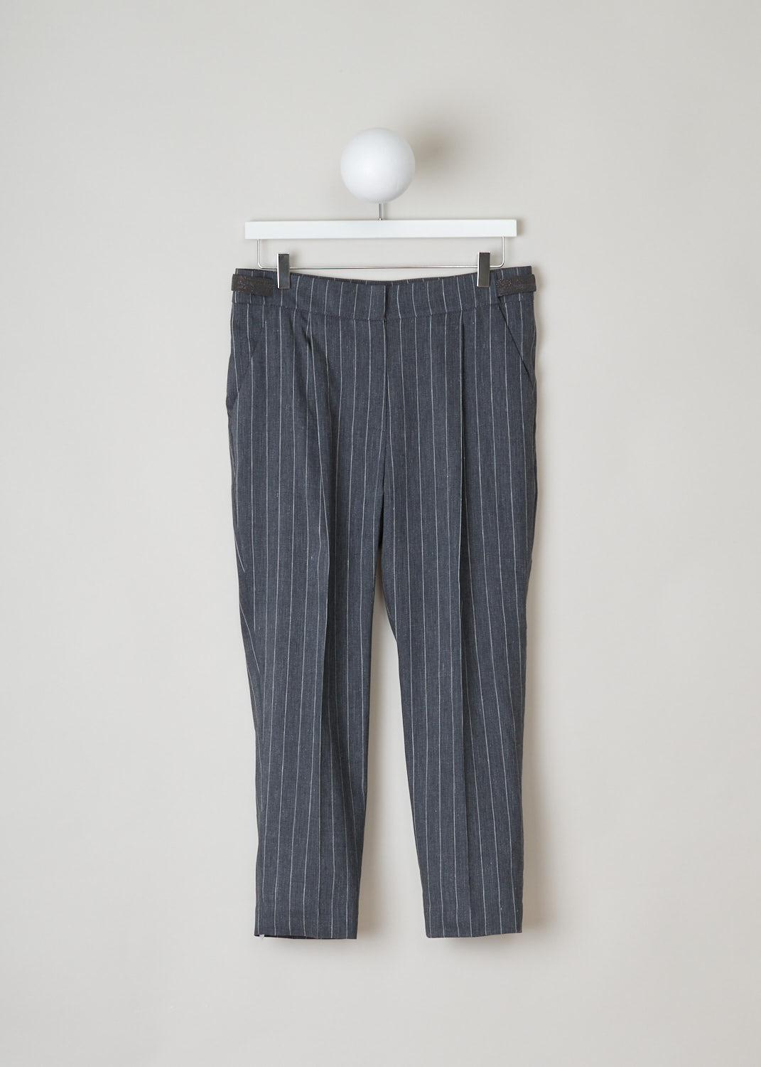 Brunello Cucinelli, mid grey pinstripe pants, MF554P6492_C002, grey white, front, Mid grey pants, made of a pinstripe fabric. A notable feature of this model are the side tabs, that are used instead of belt loops. Furthermore, this model has a wide fit and a cropped length. The attachment options on this model are metal clips, a zipper and a French bearer button.