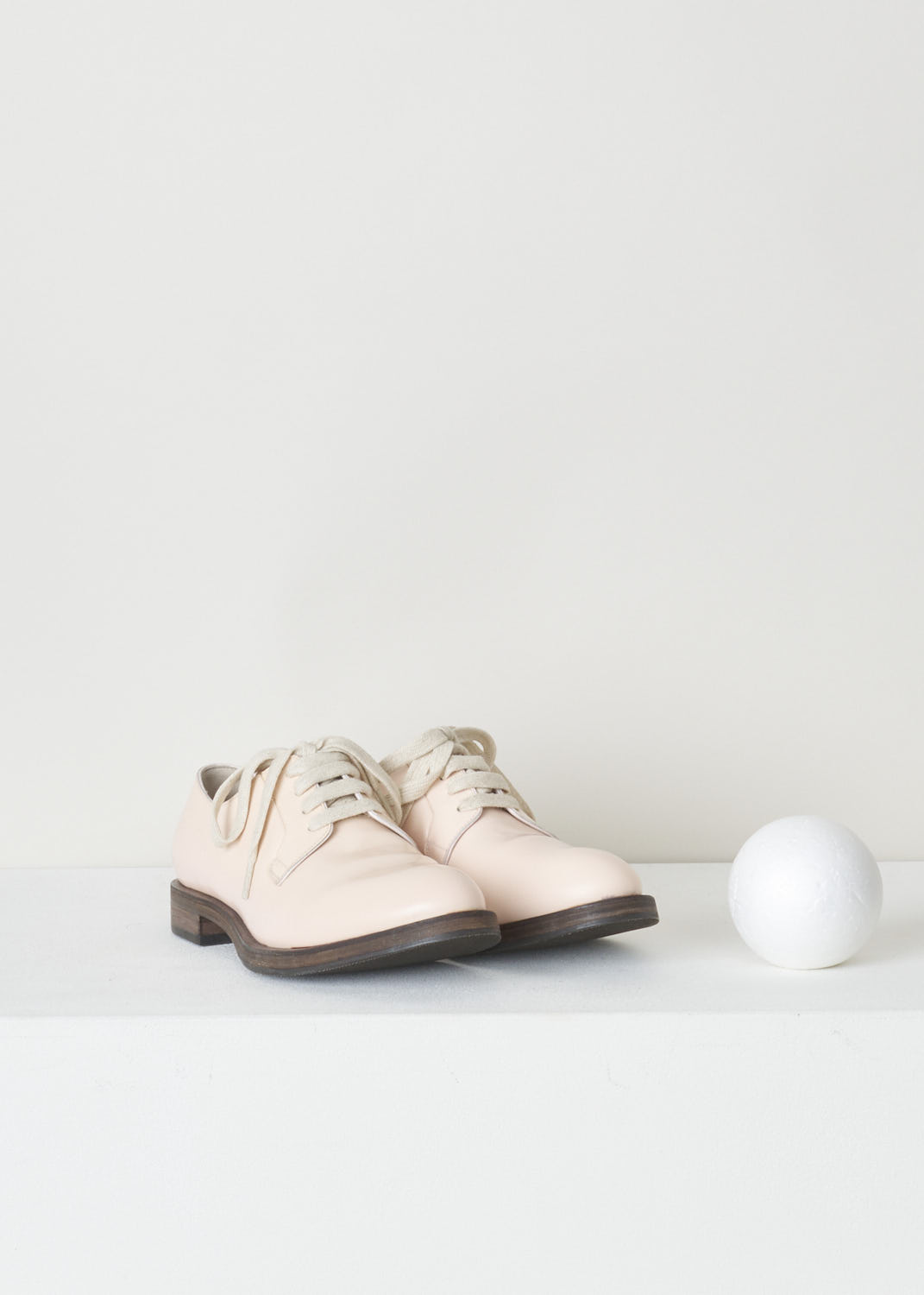 BRUNELLO CUCINELLI, BLUSH PINK DERBY SHOES, MZDVLC113_C6203, Pink, Front, Pale blush pink leather derby shoes with a shiny finish. This model has a classic lace-up closure. These shoes have a rounded toe. The sole is a contrasting dark brown color. 

Heel height: 1.5 cm / 0.5 inch 
