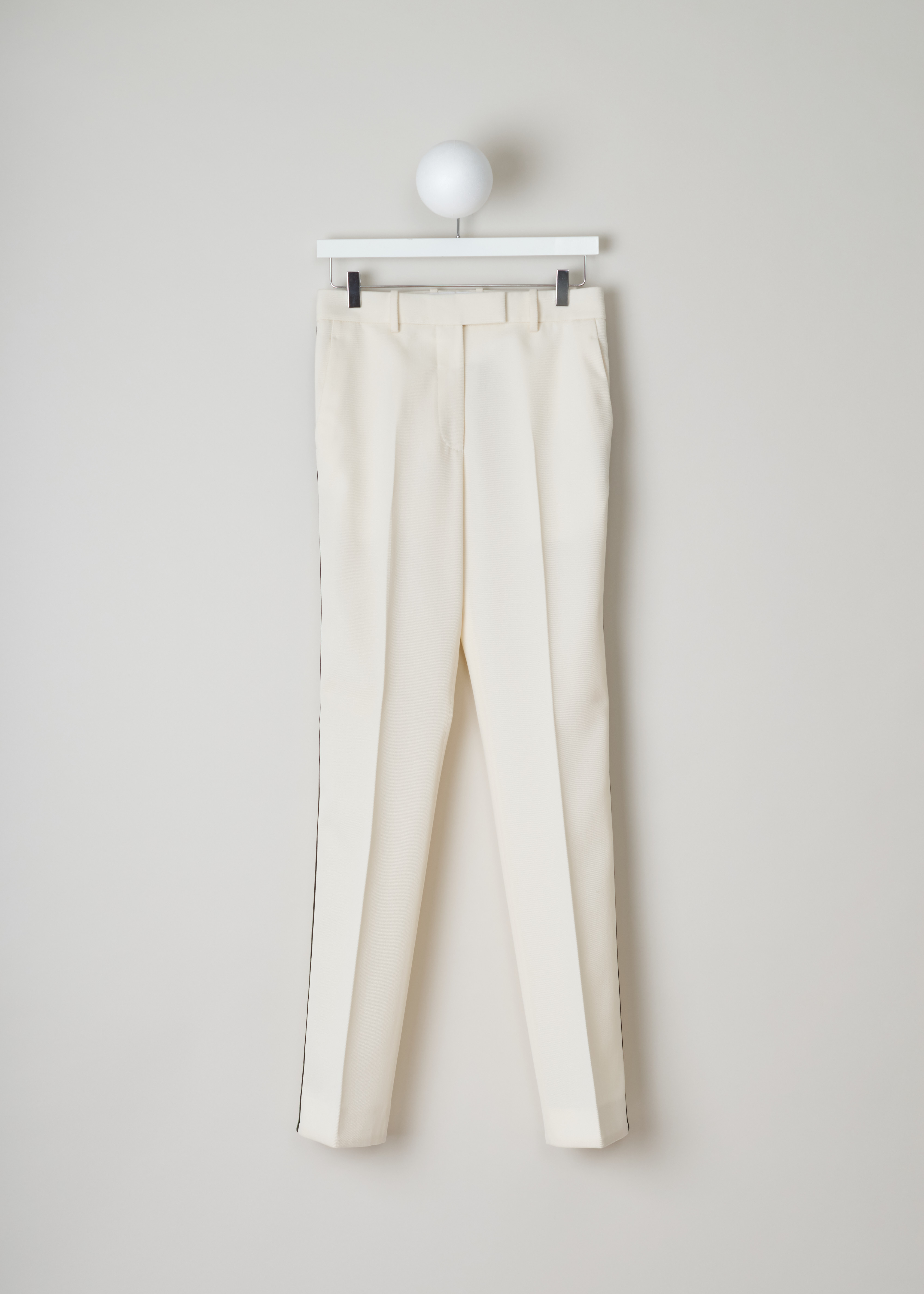 Calvin Klein 205W39NYC Off-white pants with ribbon trim
74WWPA47_W023_101 white front. Off-white wool pants with a green and black side ribbon trim.
These straight pants have two slant pockets on the front and a welt pocket on the back.
