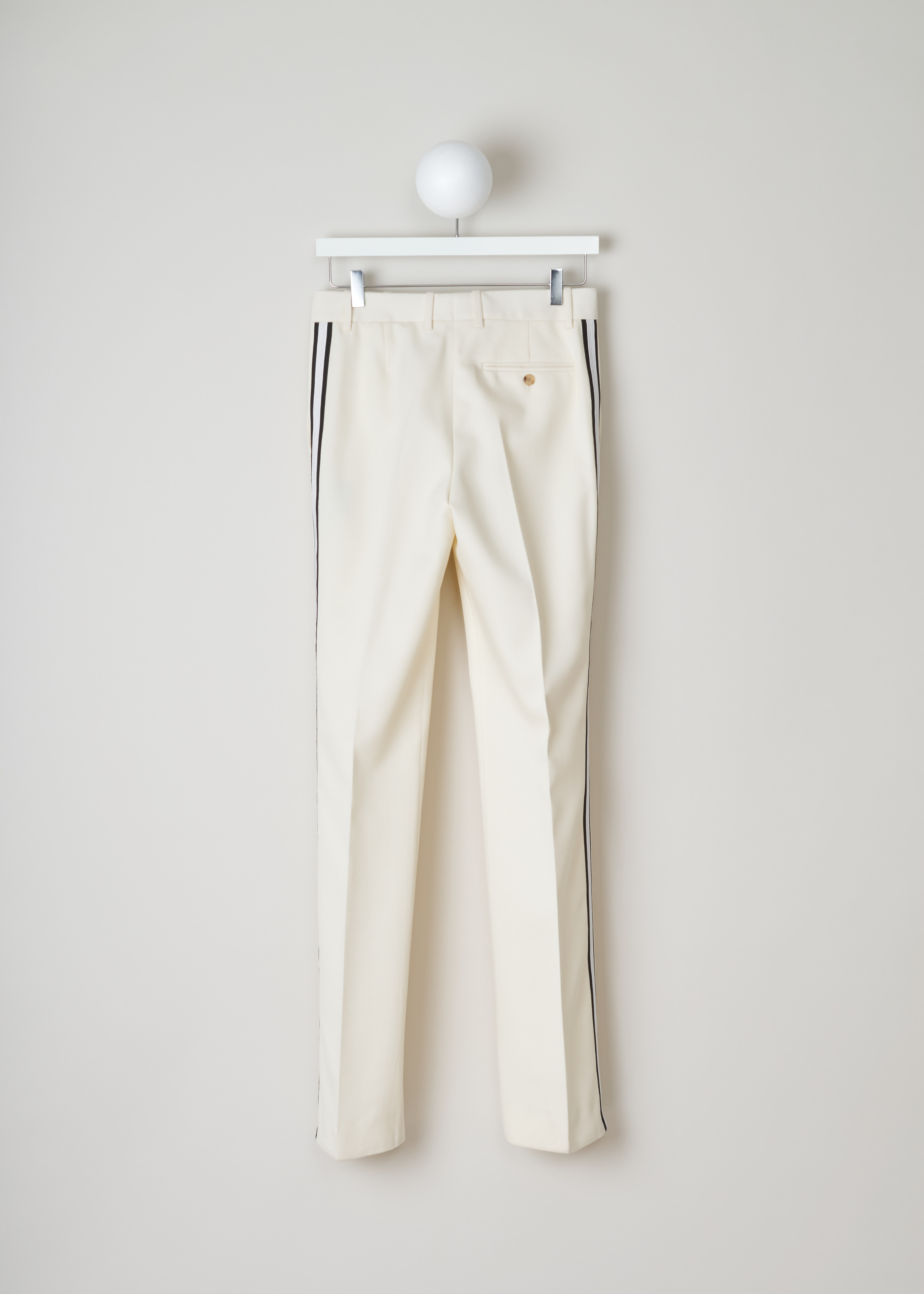 Calvin Klein 205W39NYC White pants with ribbon trim
84WWPB22_W037_197 off-white back. Off-white wool pants with a white and black side ribbon trim.
These straight pants have two slant pockets on the front and a welt pocket on the back.