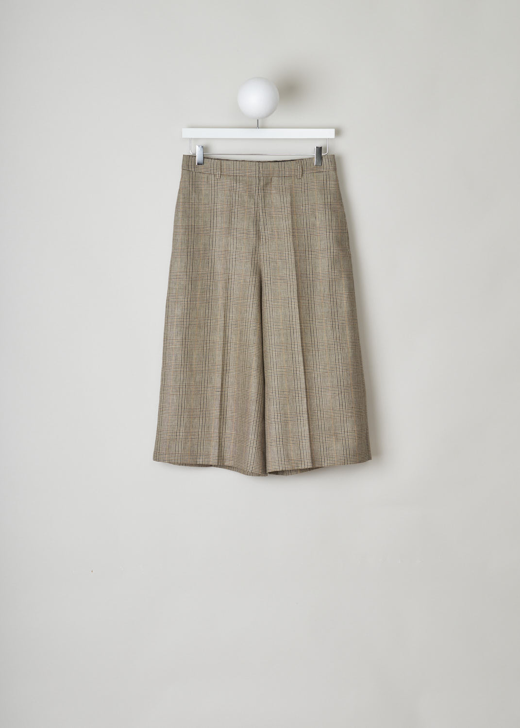 CELINE, BROWN CHECKERED CULOTTES, 024I_2P233_12MC, Brown, Front, Brown checkered culottes made from wool. These pants have belt loops and the closing option on this model is a concealed hook, button and zipper. Along the length of the pant legs, creases can be found. These pants have slanted pockets in the front and two buttoned welt pockets in the back.


