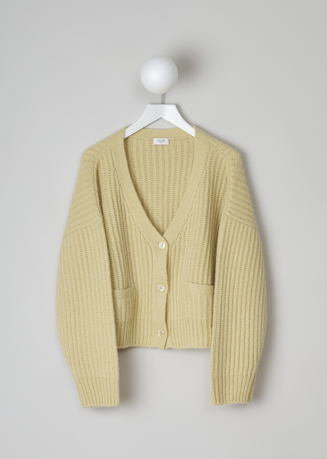 CELINE, PALE YELLOW CASHMERE CARDIGAN, 266R_2A49X_11PY,  Yellow, Front, This pale yellow cashmere cardigan has a V-neck with a front button closure. The cardigan has dropped shoulders. In the front, the cardigan has two patch pockets. 
