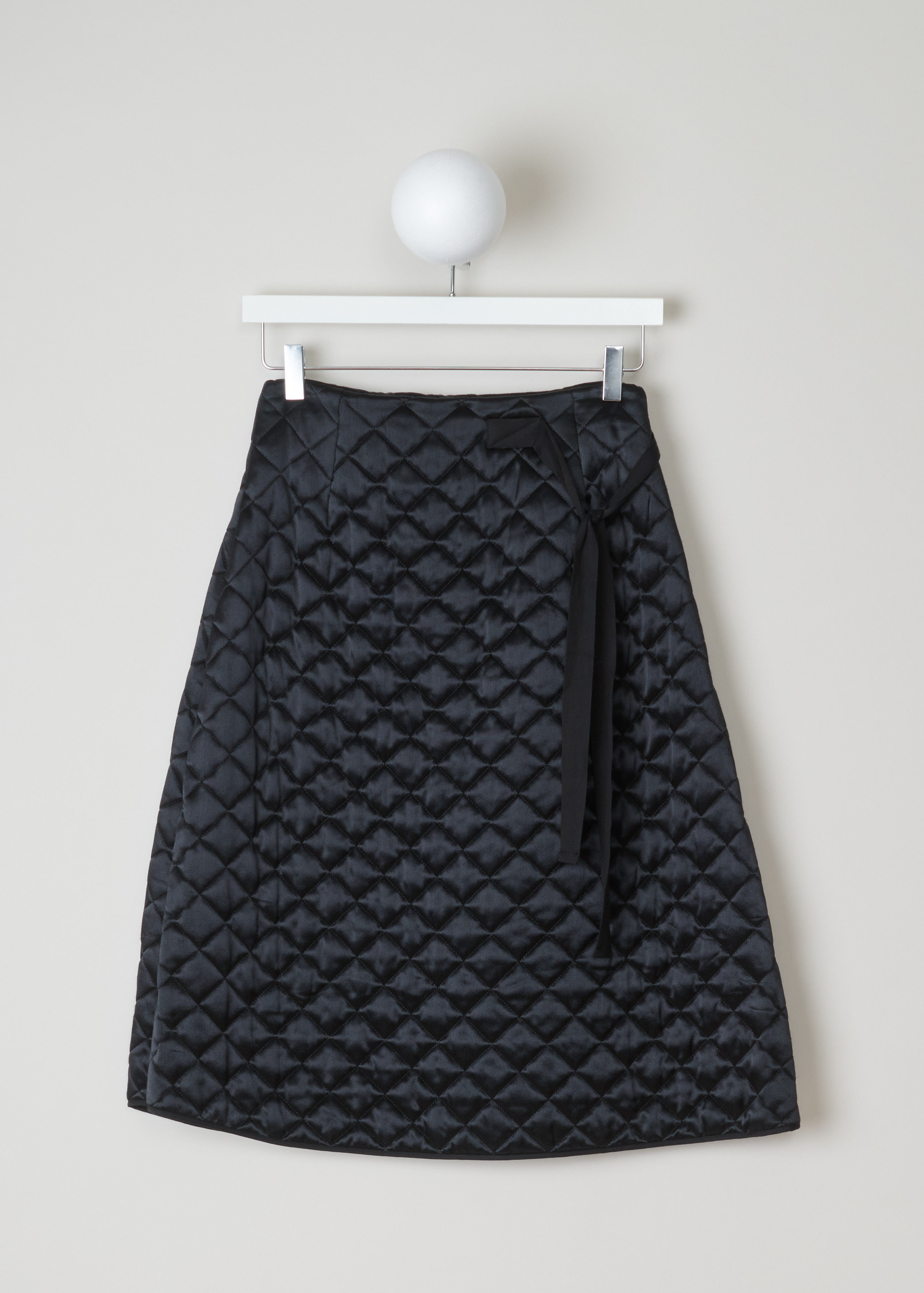 CÃ©line Quilted skirt 6563_22M90_0N0 black front. Black quilted A-line skirt with bow detail and zip fastening on the side.