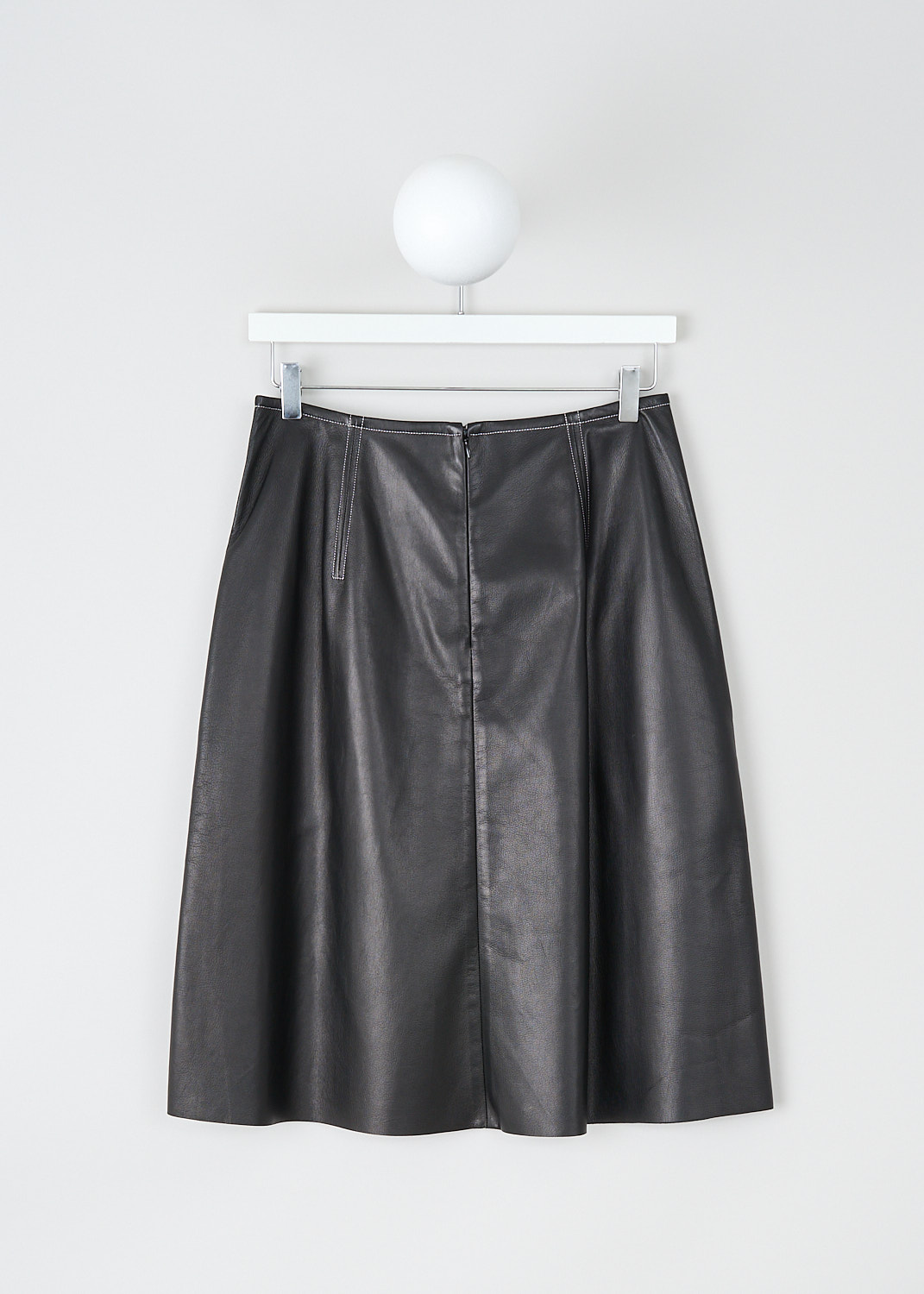 Celine, Flared black leather skirt, 6828_22N21_0N0, Black, Back, This flared black leather skirt has an A-line silhouette. A concealed centre zip in the back functions as the closure. The skirt has concealed slanted pockets. Contrasting white stitching has been used throughout. 
