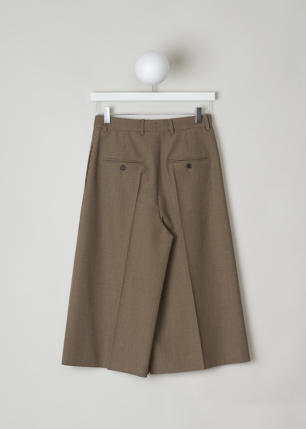 CELINE, BROWN HOUNDSTOOTH CULOTTES, 868H_2P233_28BZ, Brown, Print, Back, Brown Houndstooth culottes made from wool. These pants have belt loops and the closing option on this model is a concealed hook, button and zipper option. In the front, along the length of the pants, a front pleat can be found. These pants have slanted pockets in the front and two welt pockets in the back.
